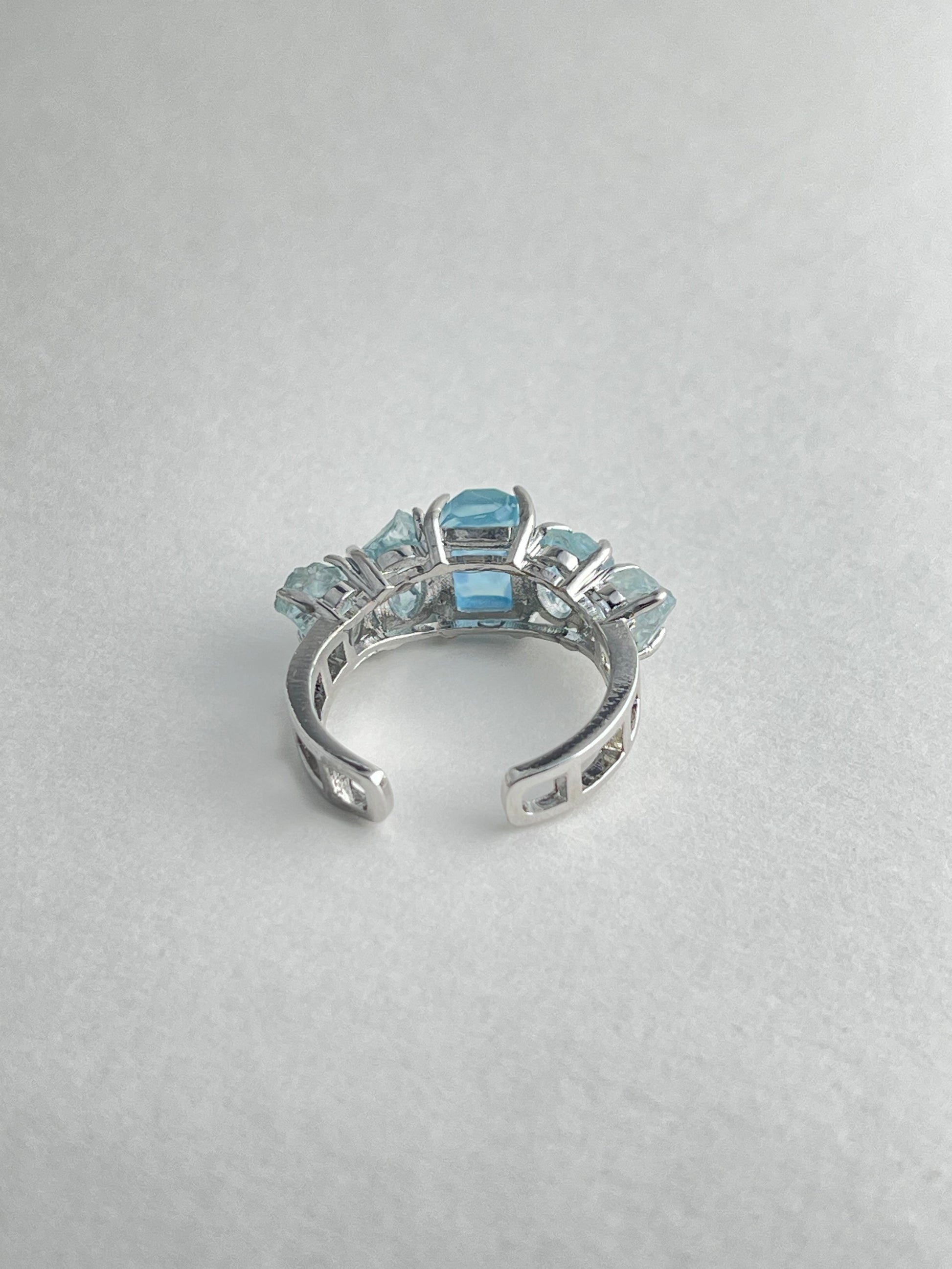 Back view of aquamarine row ring adjustable band natural crystal jewelry