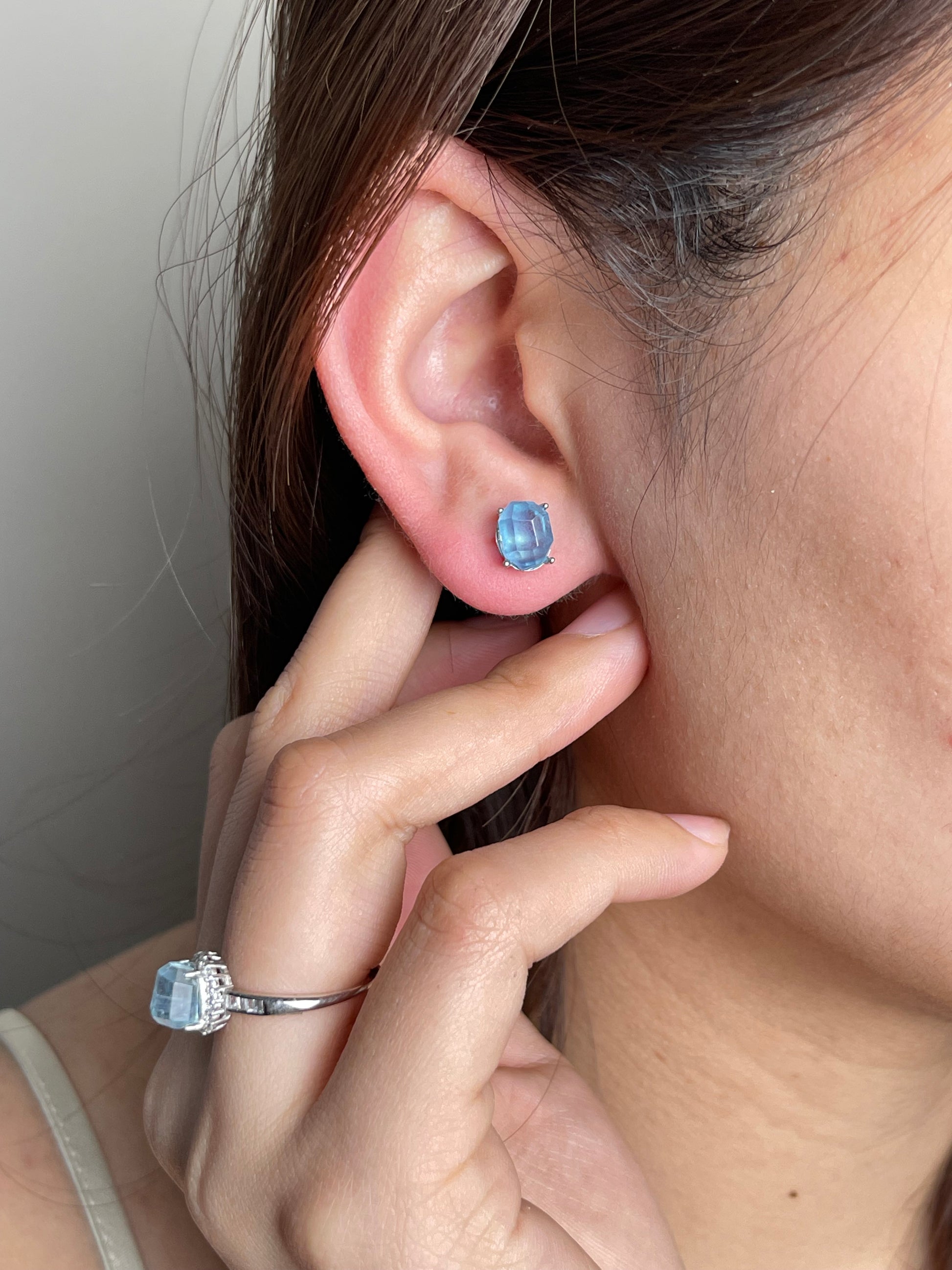 Aquamarine Stud Earrings worn on ear
