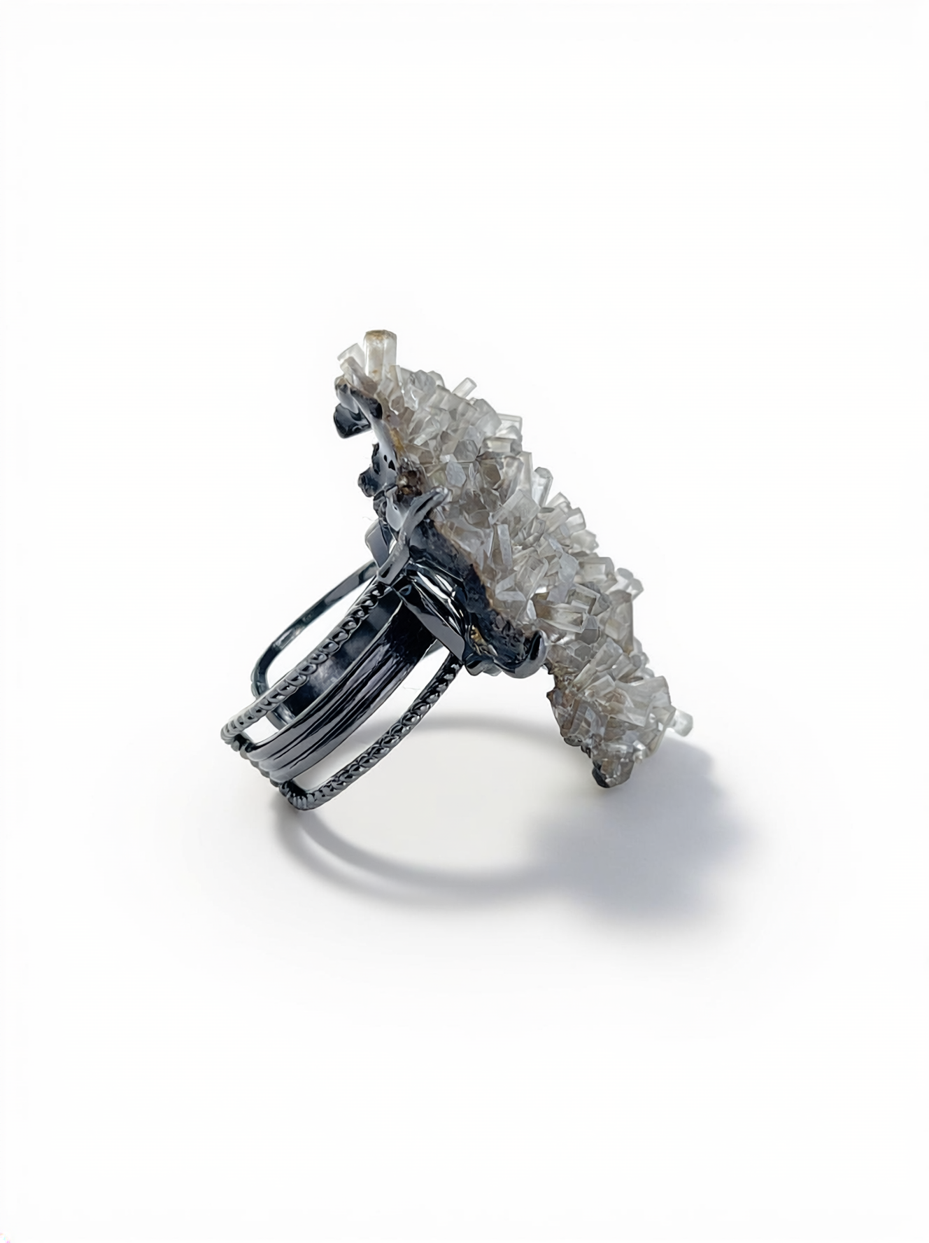 Side view of Aurora Calcite cluster mineral specimen ring.