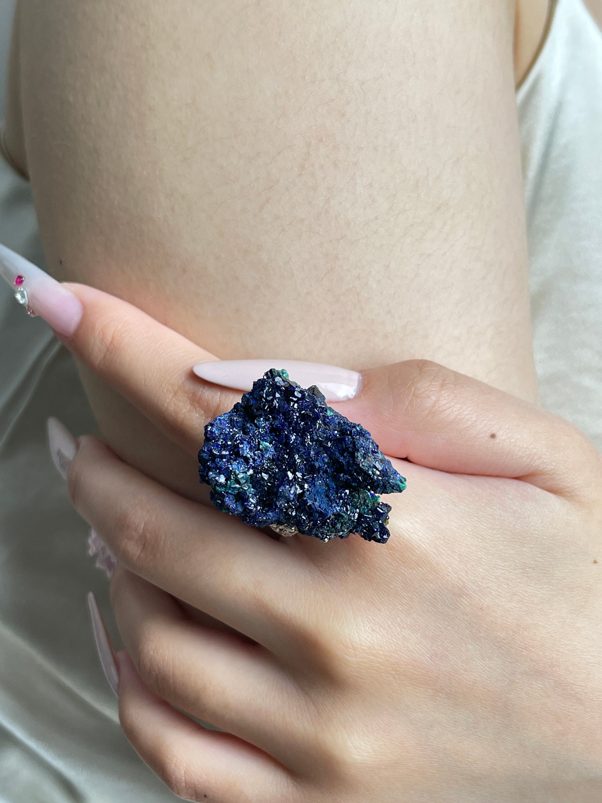 Close-up of Azurite mineral specimen ring worn on hand