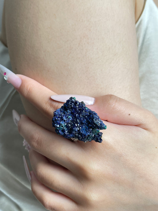 Close-up of Azurite mineral specimen ring worn on hand