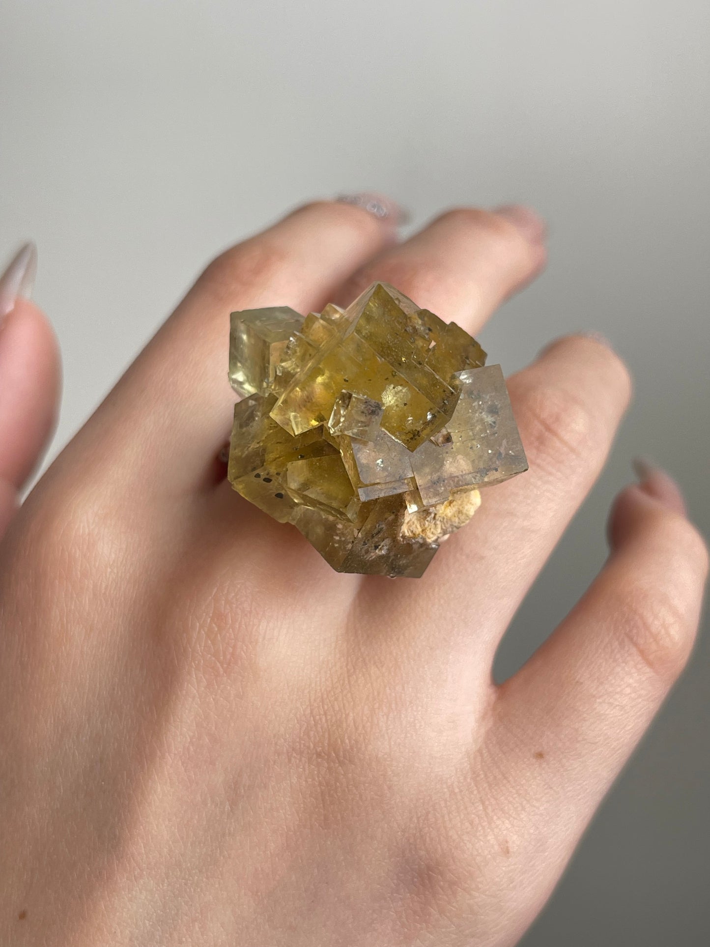 Beijing Honey Fluorite on Matrix Ring close-up worn on hand