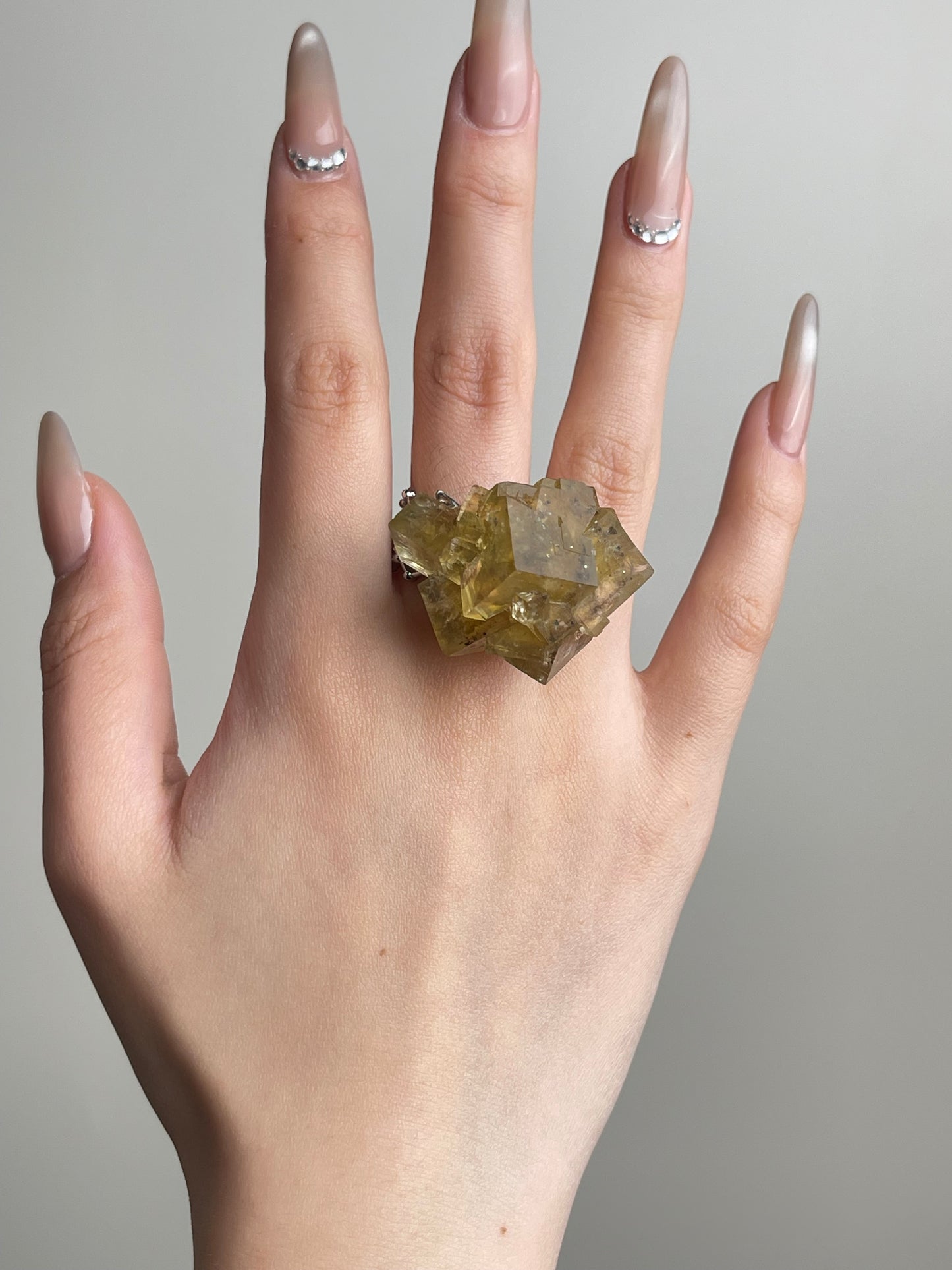 Beijing Honey Fluorite on Matrix Ring worn on hand