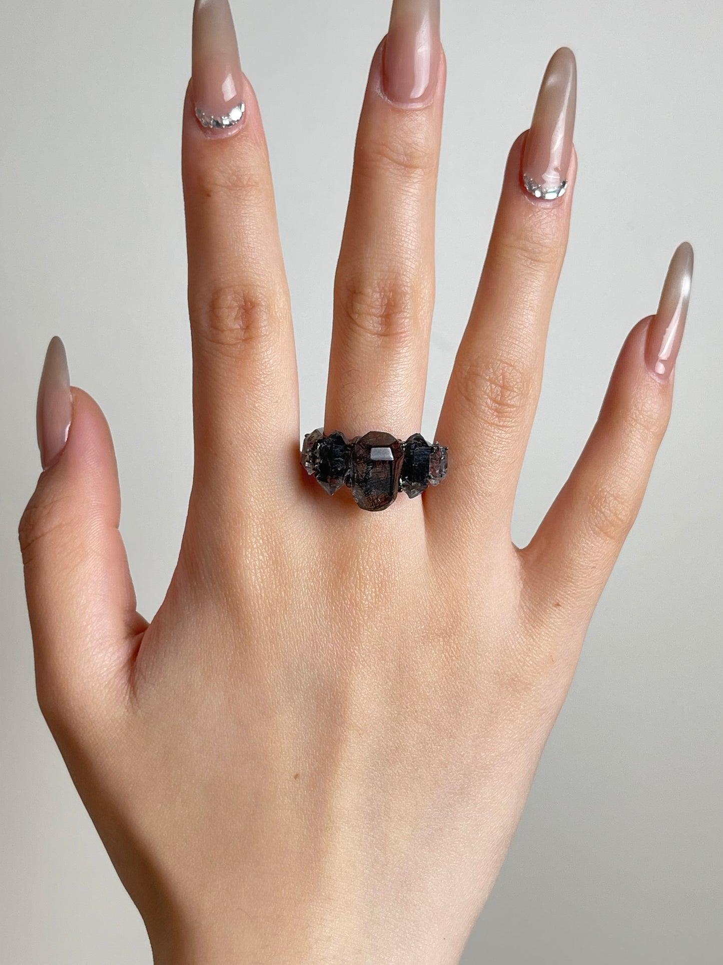 Hand shot of Black Rutilated Quartz and Hakima Diamond Quartz ring by Oryssia
