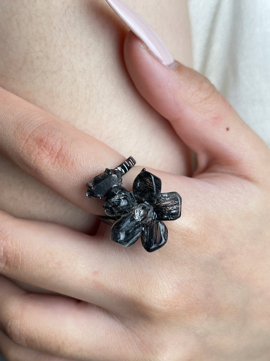 Close-up hand view of Black Rutilated Quartz flower and Herkimer Diamond Quartz ring