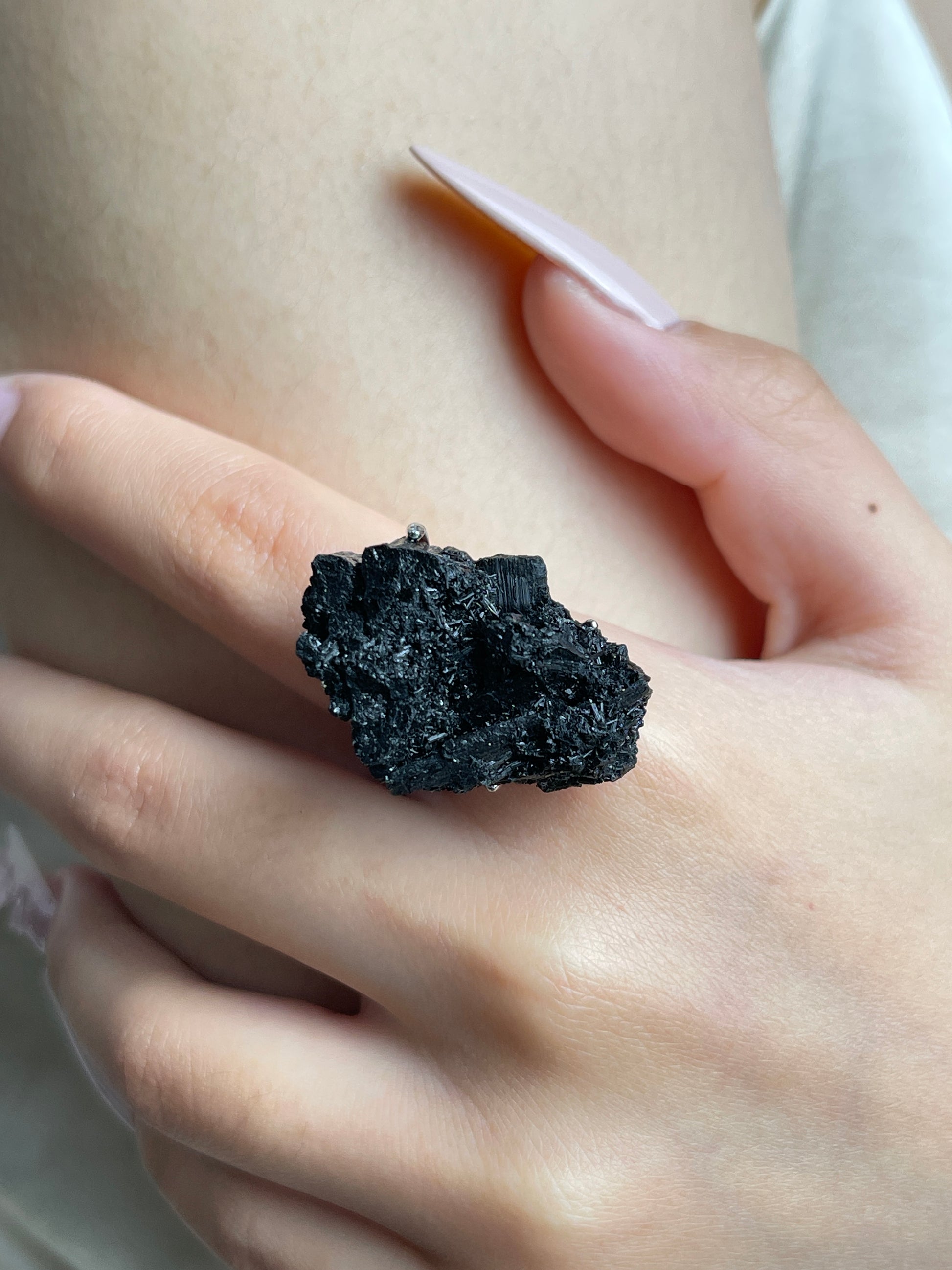 Close-up of Black Tourmaline Cluster Ring worn on hand