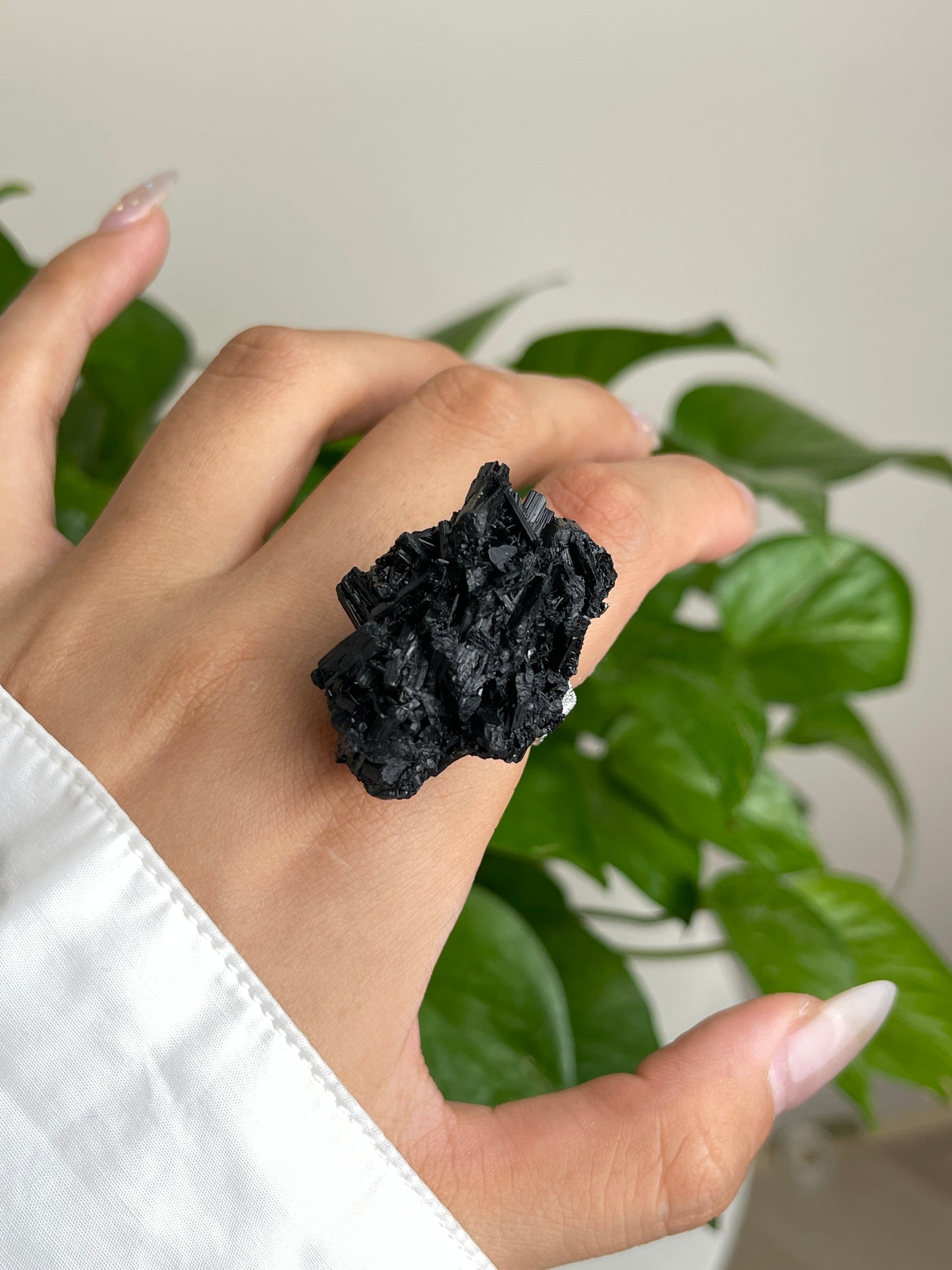 Close-up of Black Tourmaline Cluster Ring worn on hand