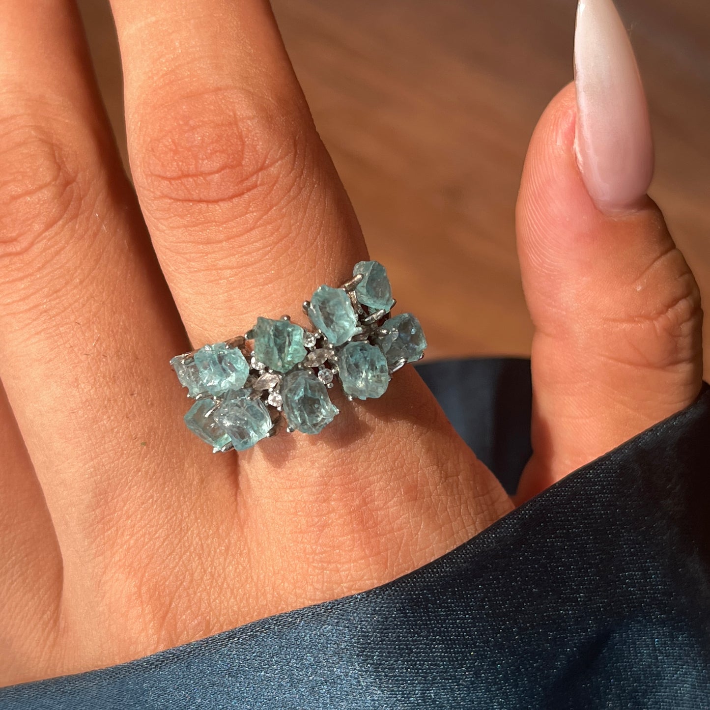 close up of blue apatite double row ring showing vivid blue crystals