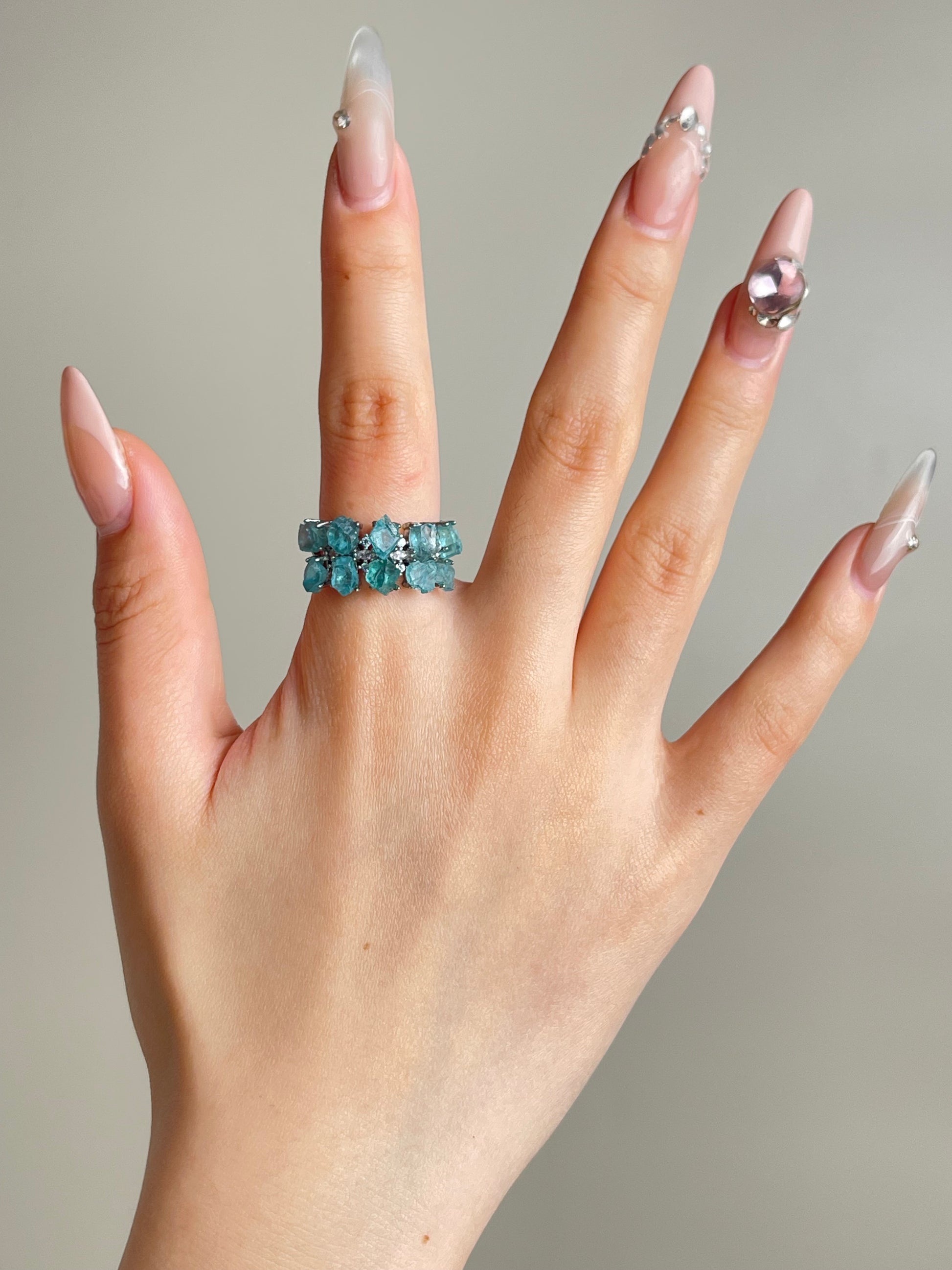 blue apatite crystal ring worn on hand double row design