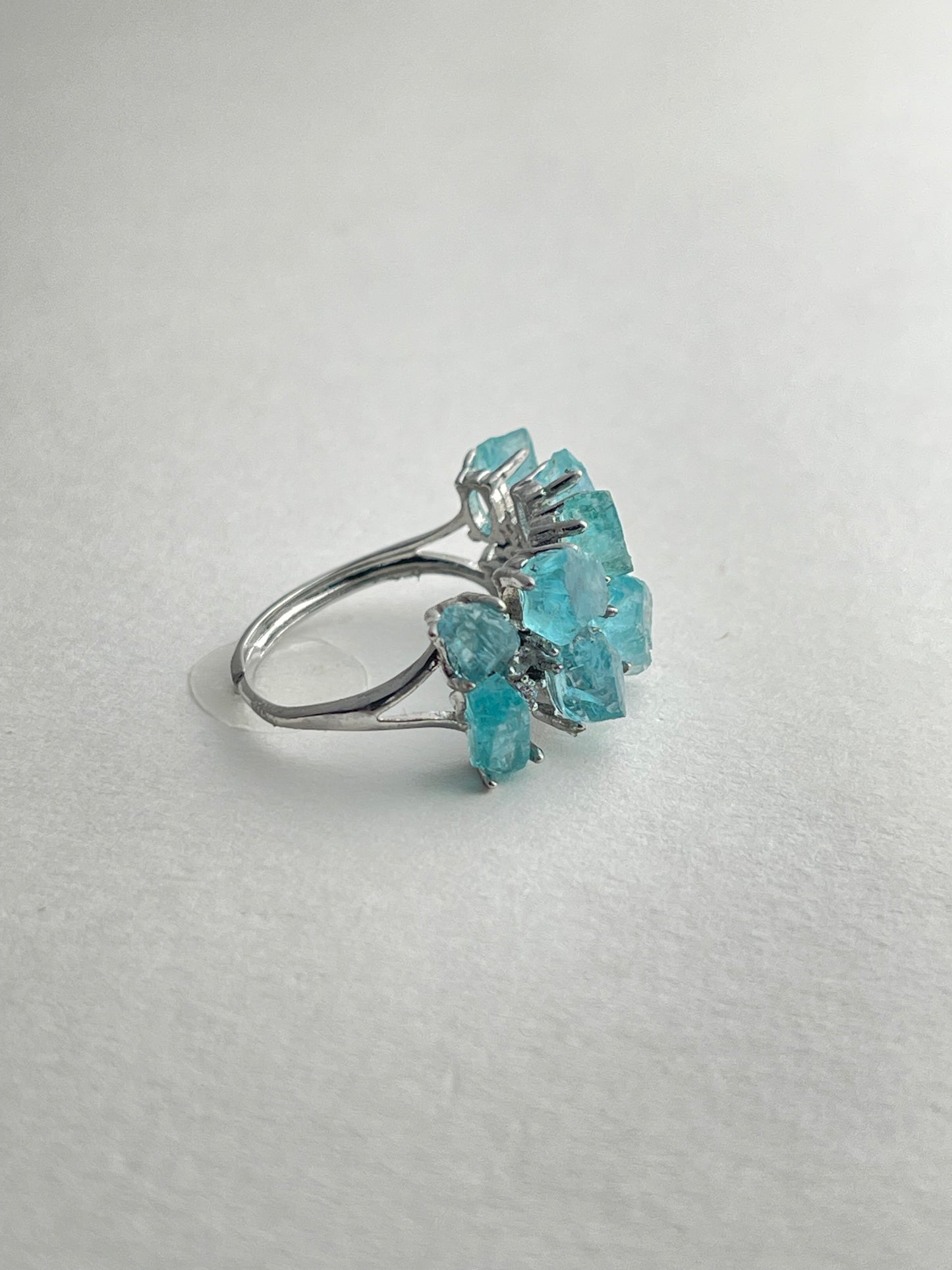 side view of blue apatite ring adjustable silver band