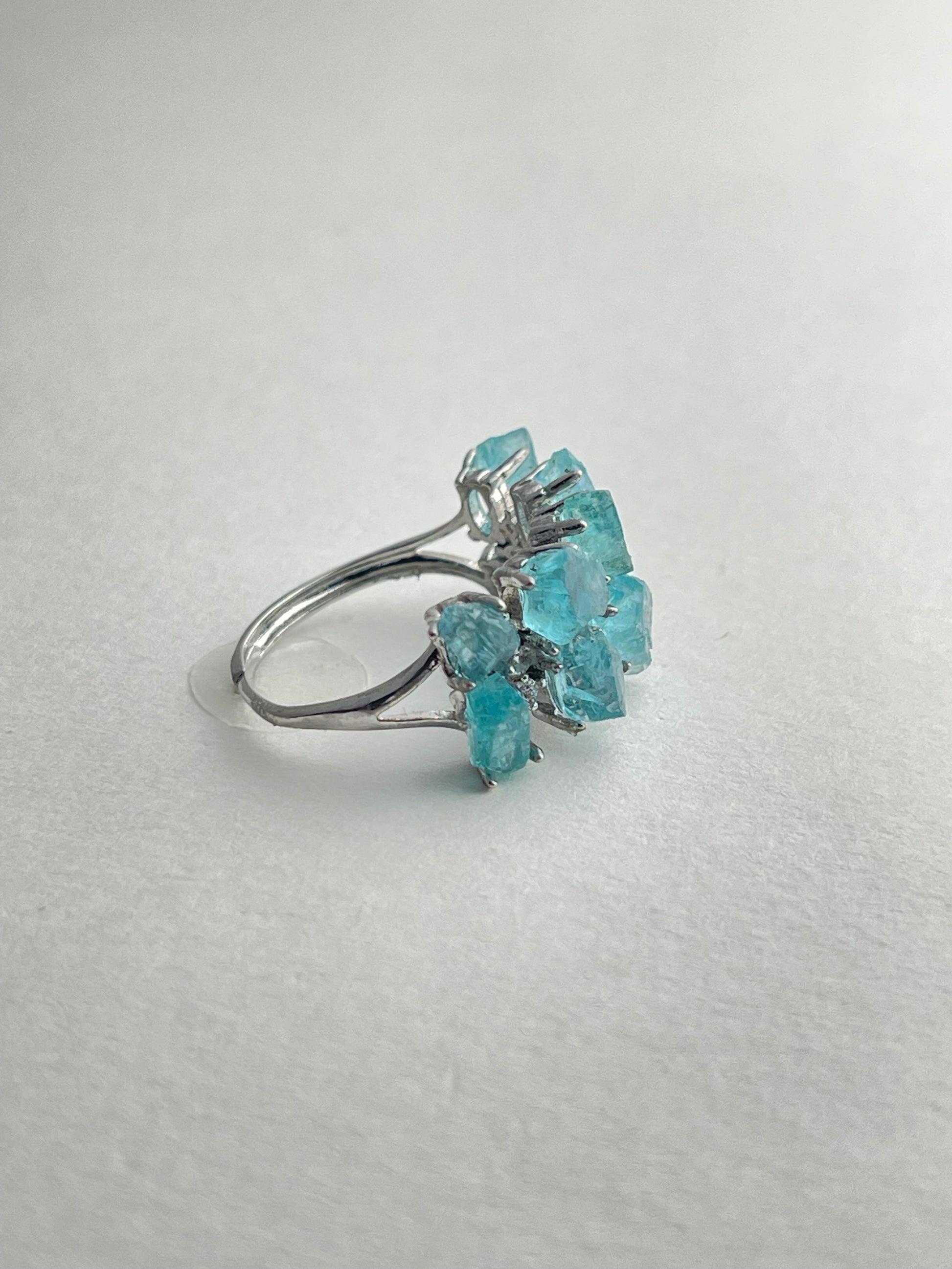 side view of blue apatite ring adjustable silver band