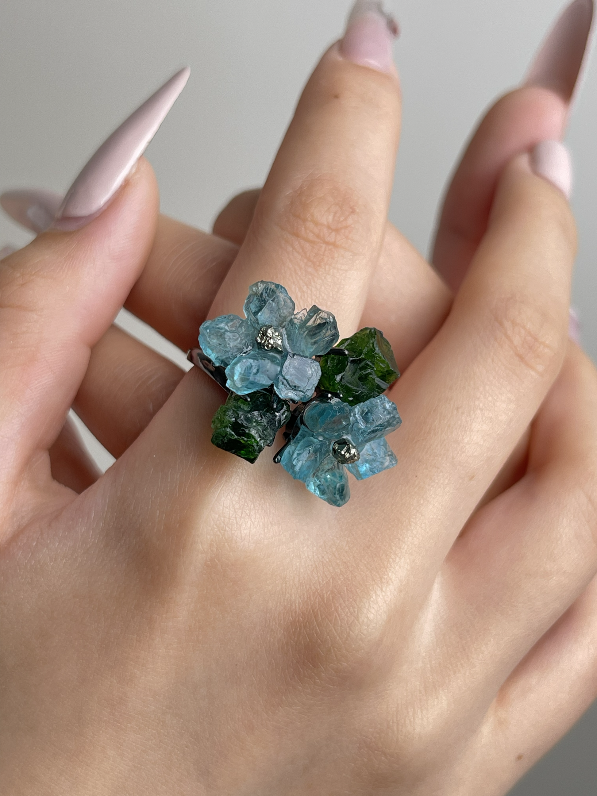 Blue Apatite flower mineral specimen ring worn on hand
