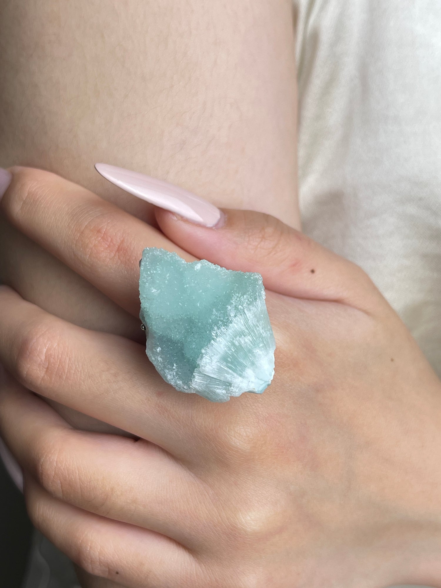 Close-up hand view of Blue Aragonite mineral specimen ring