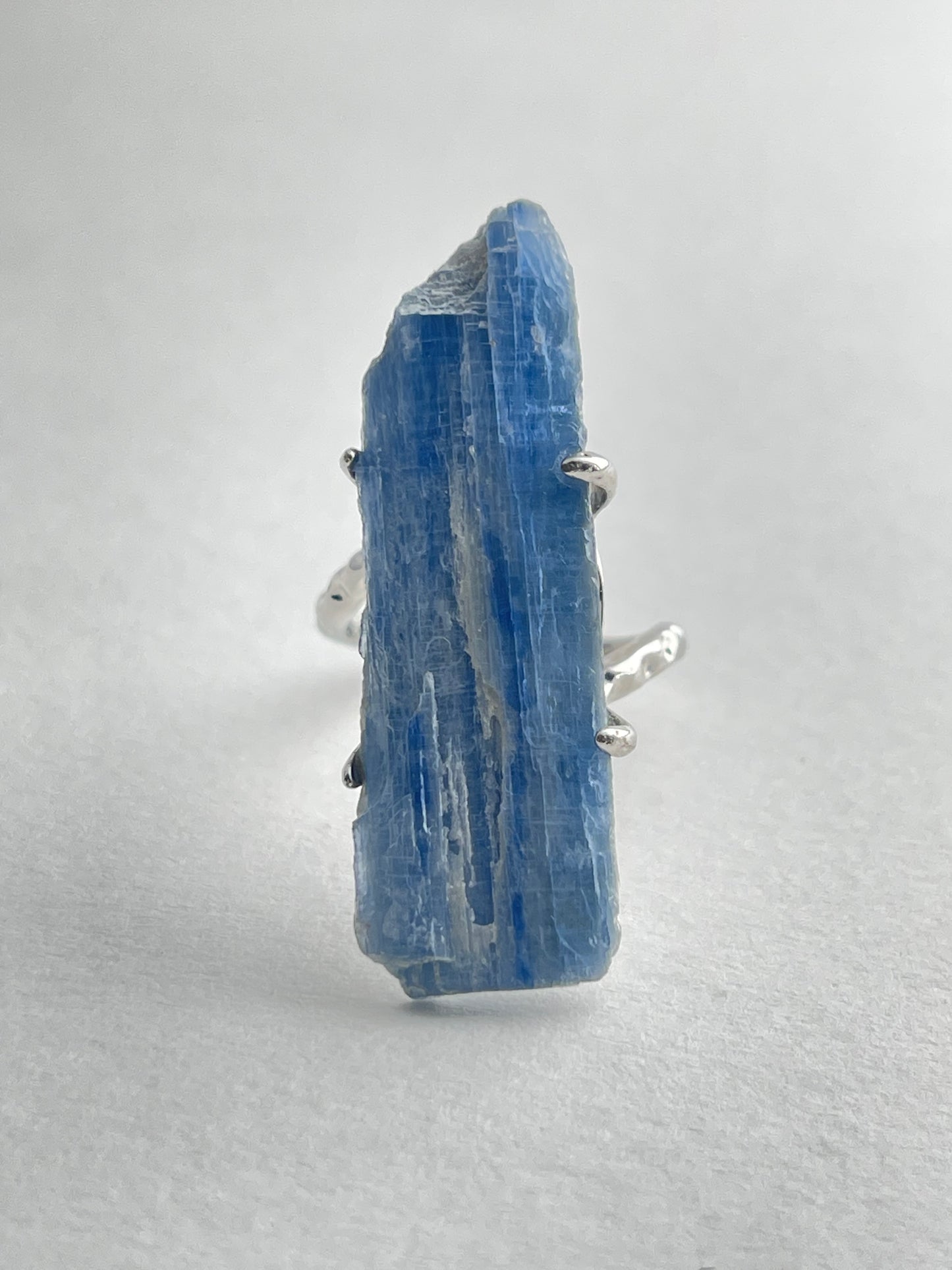 Blue kyanite mineral specimen ring front view in silver tone finish