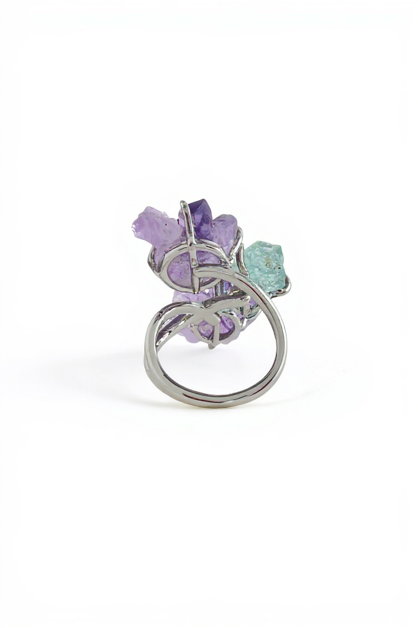 Back view of raw amethyst and aquamarine crystal flower ring showing adjustable band and crystal setting
