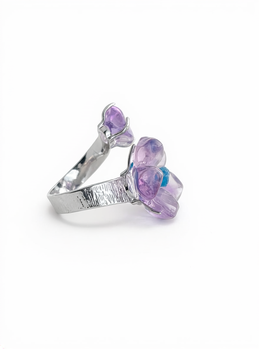 Side view of Brazilian amethyst flower ring with blue apatite