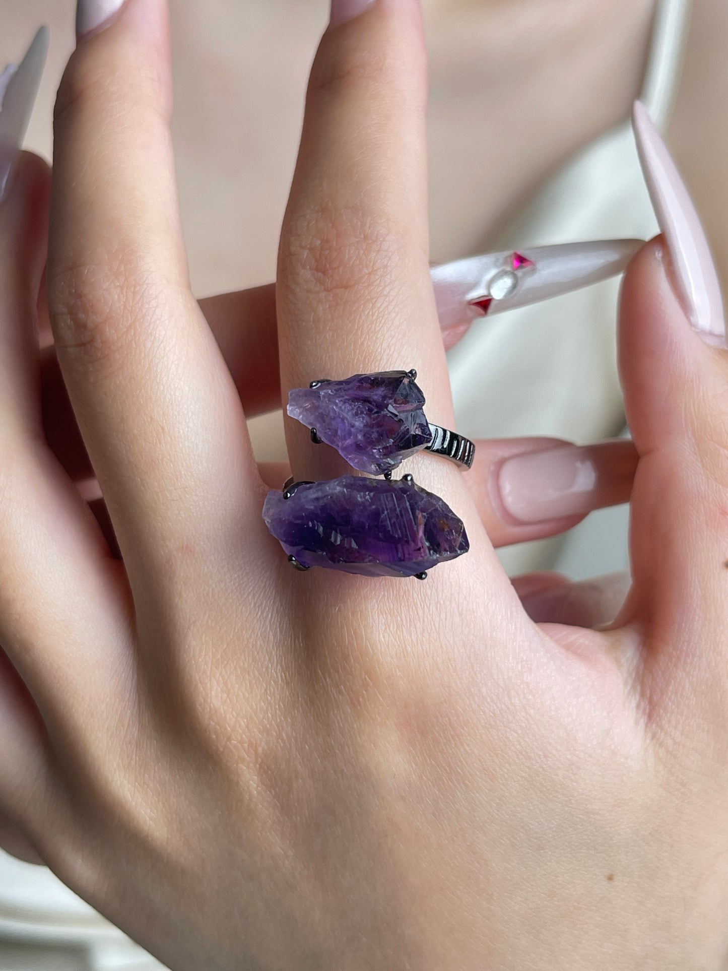 Raw Brazilian Amethyst crystal ring worn on hand