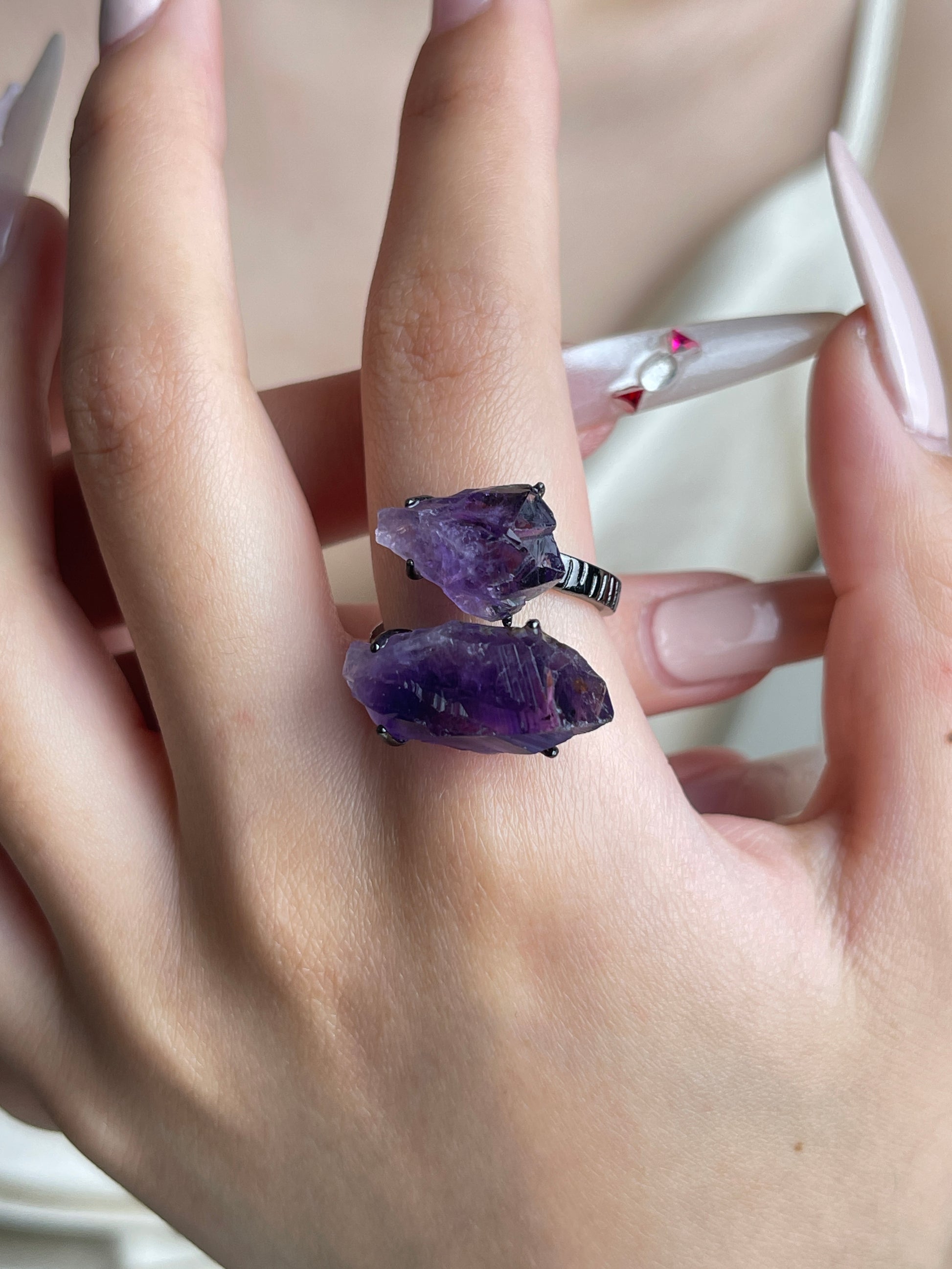 Raw Brazilian Amethyst crystal ring worn on hand
