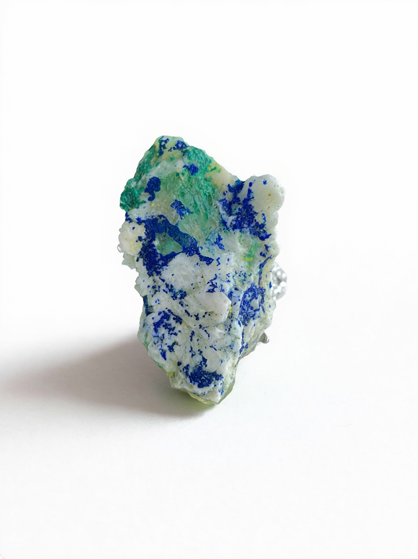 Chalcopyrite with malachite and quartz mineral specimen ring from China, front view.