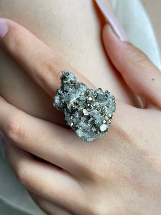 Close-up hand view of a Chalcopyrite with Quartz cluster mineral specimen ring.