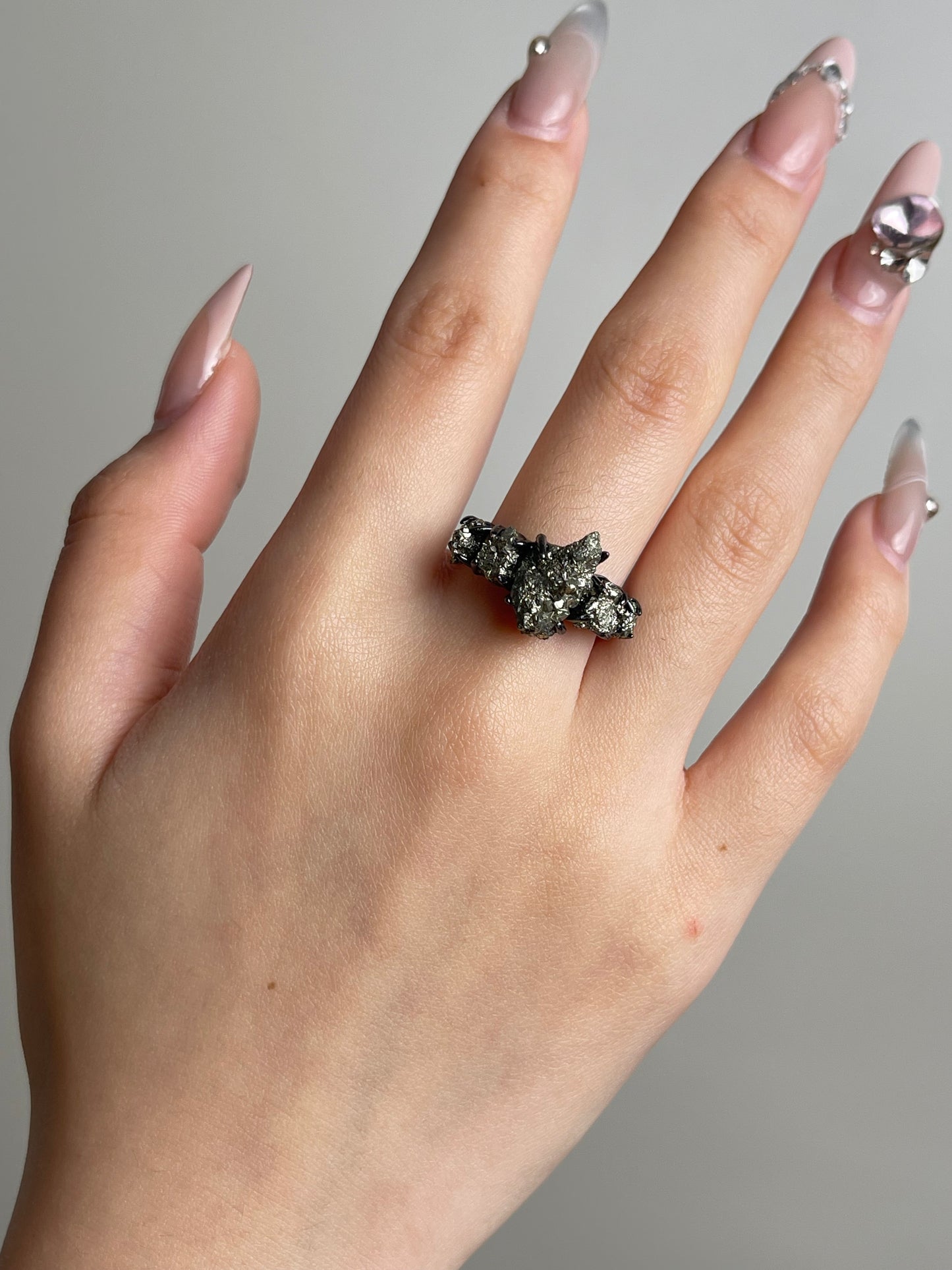 Chalcopyrite raw mineral specimen ring worn on hand