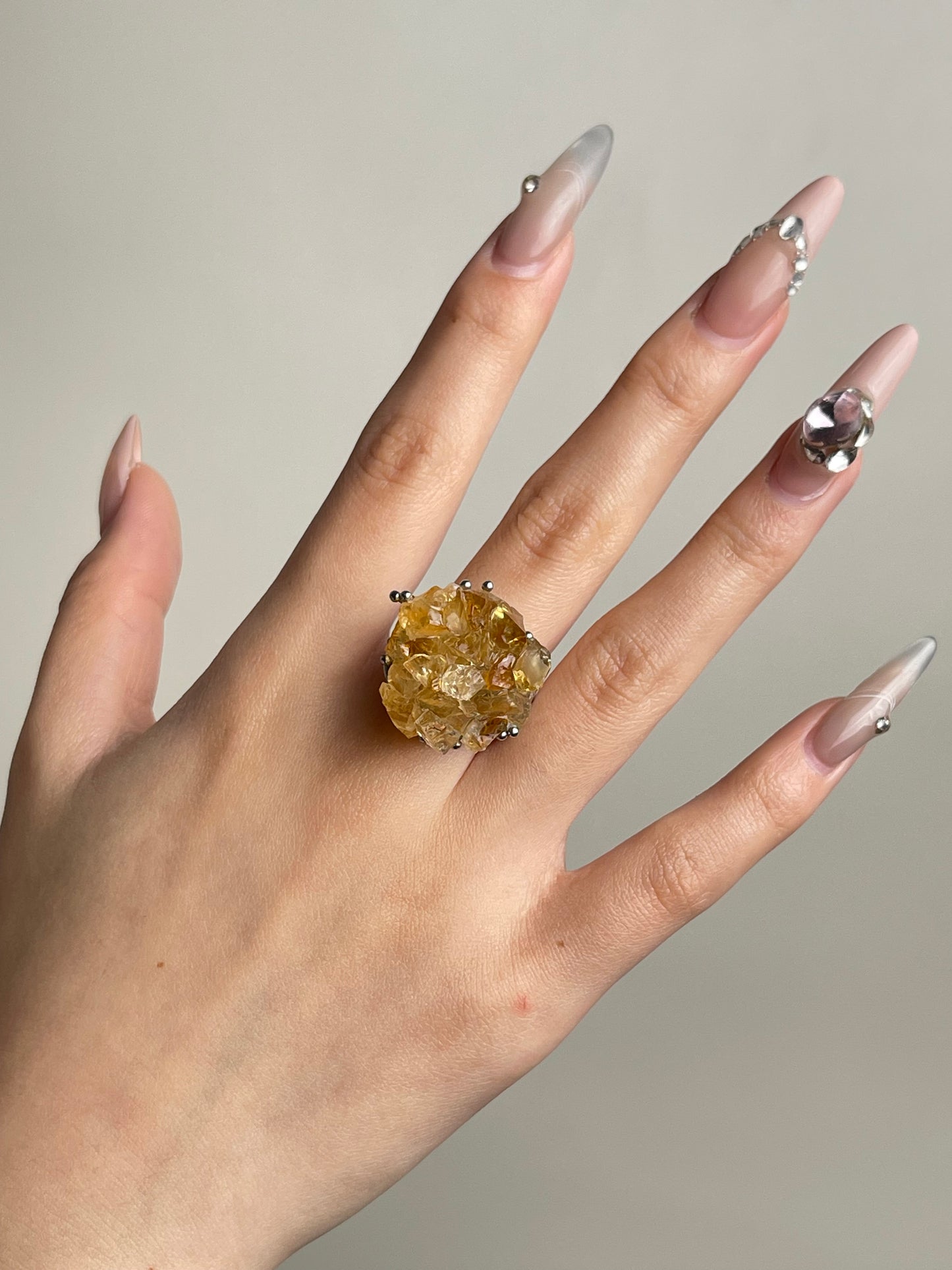 Citrine bouquet ring with hand-assembled raw crystals worn on hand