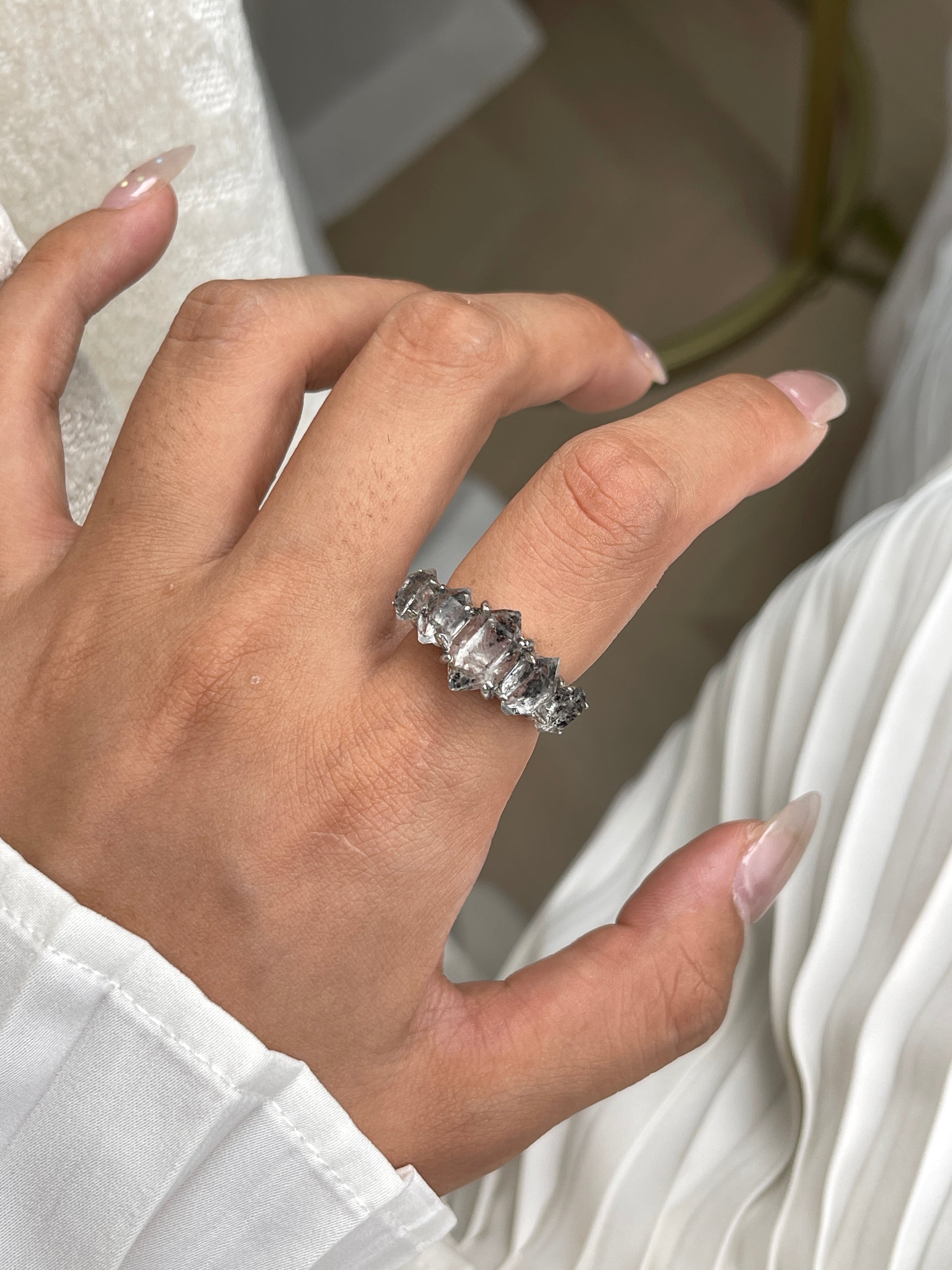 close up clear herkimer diamond quartz row ring