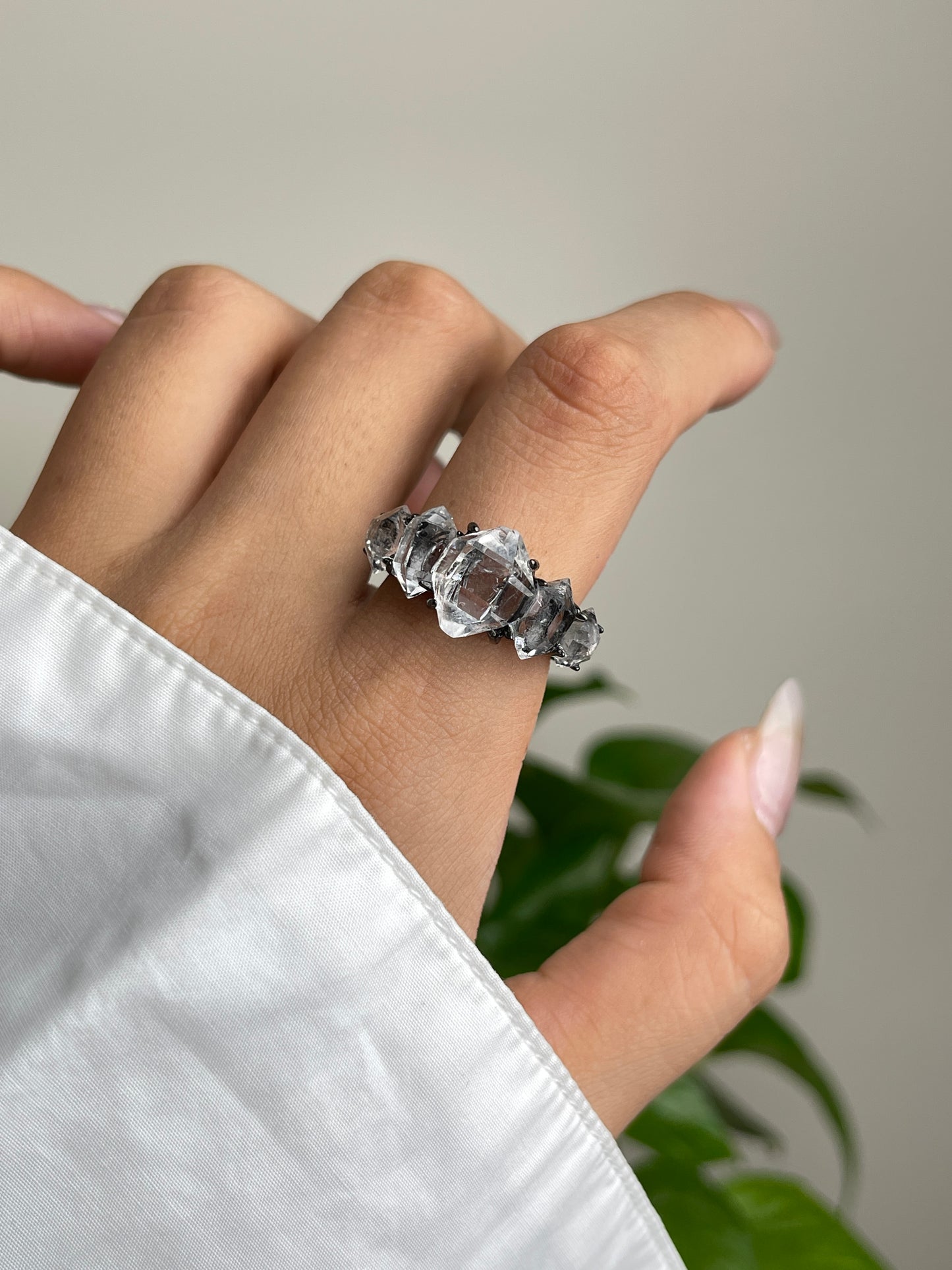 close up clear herkimer diamond quartz row ring