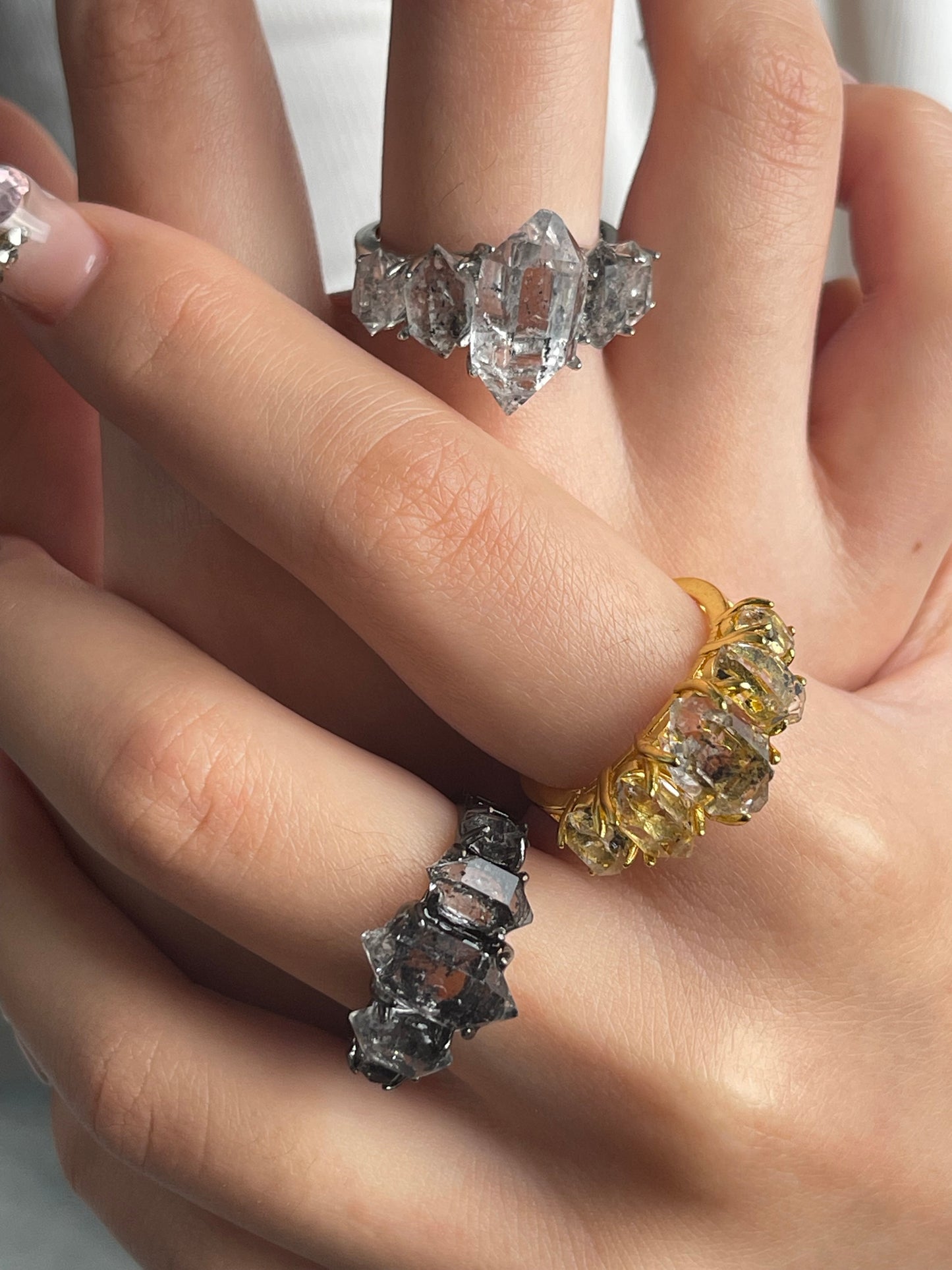 close up clear herkimer diamond quartz row ring