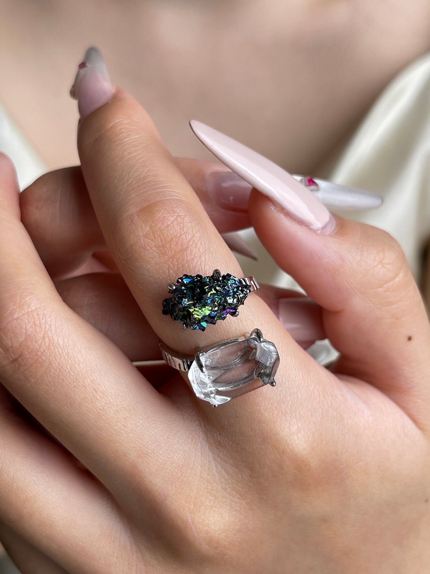 Clear Quartz and Carborundum open ring worn on hand