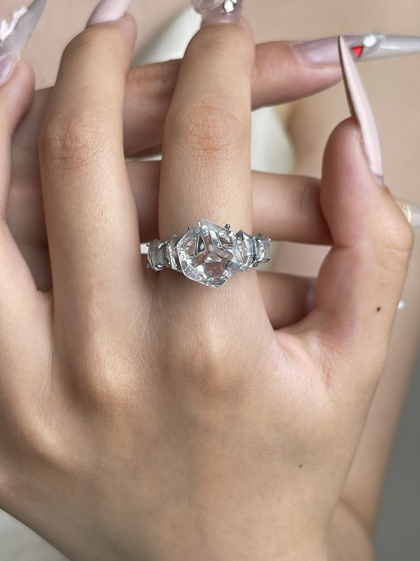 Clear Quartz cube and Herkimer Diamond Quartz ring worn on hand