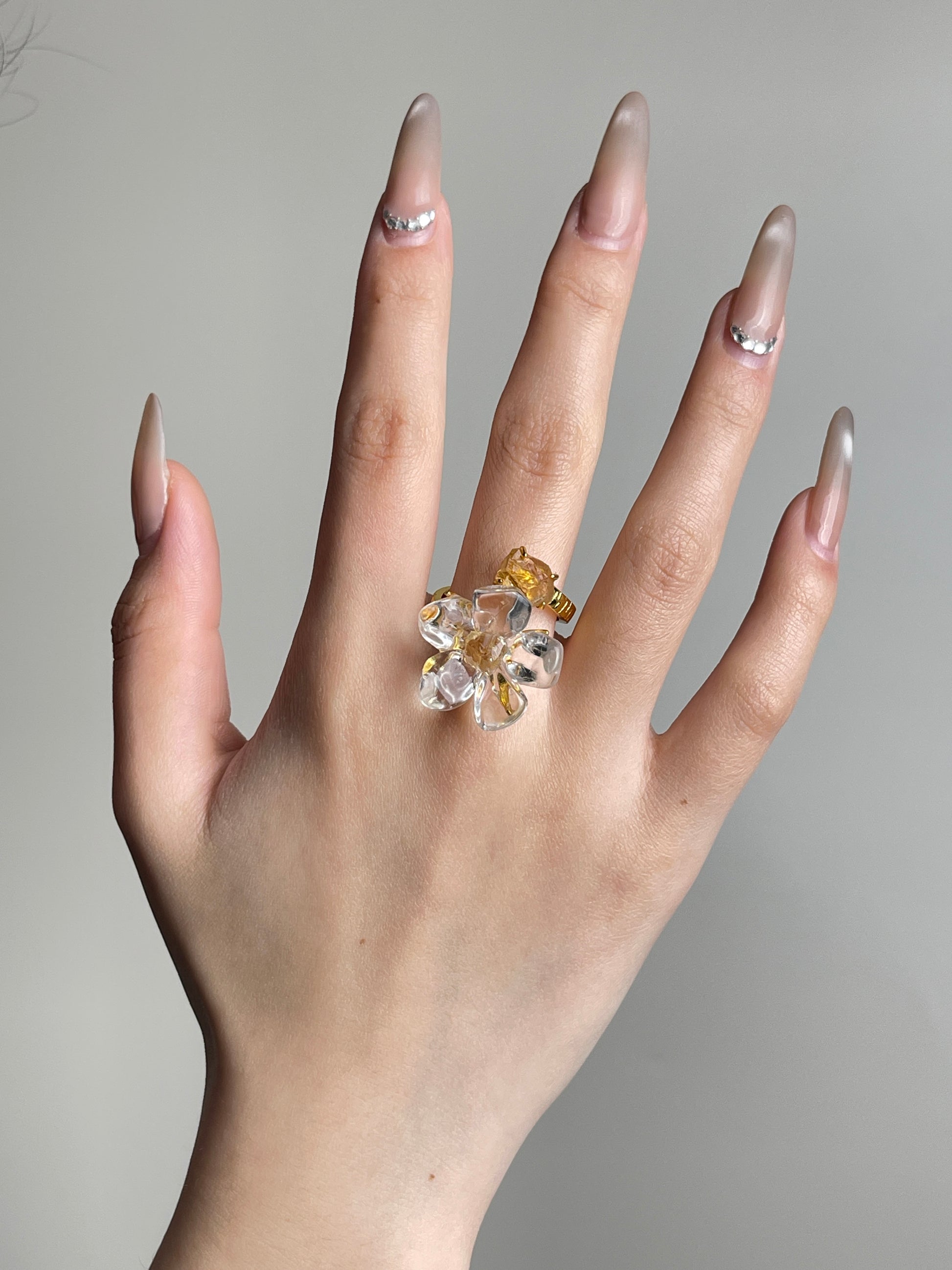 Hand view of Clear Quartz Flower Ring with raw Citrine