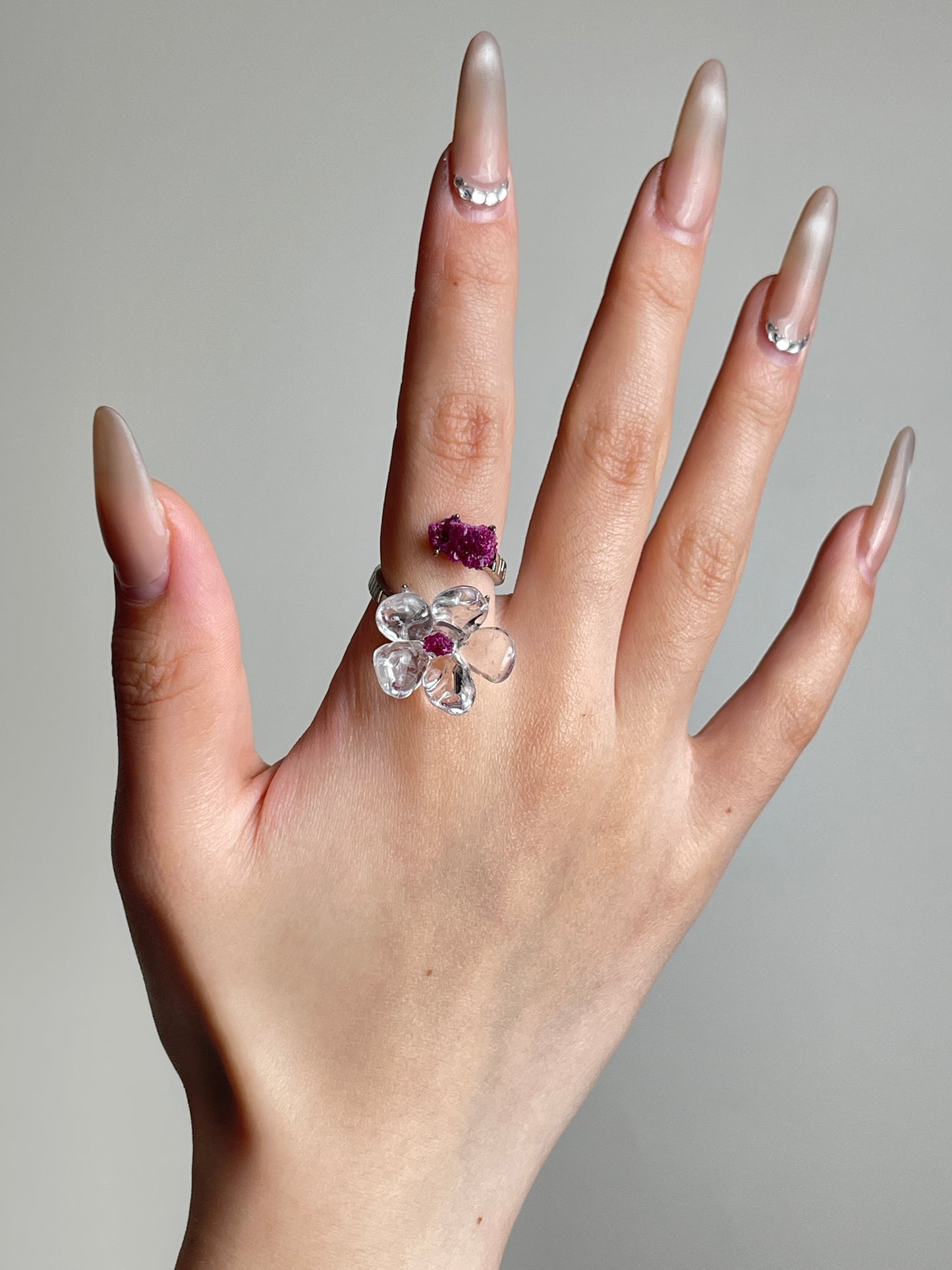 Hand view of Clear Quartz Flower Ring with raw Ruby