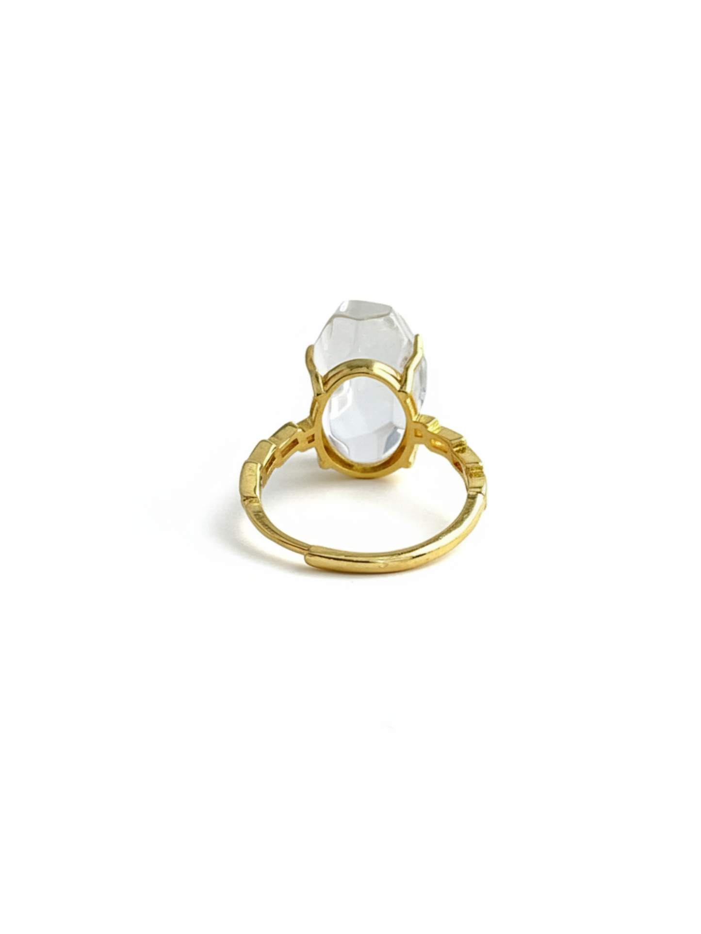 Back view of a Clear Quartz freeform ring showing the crystal setting, band details, and gold tone finish