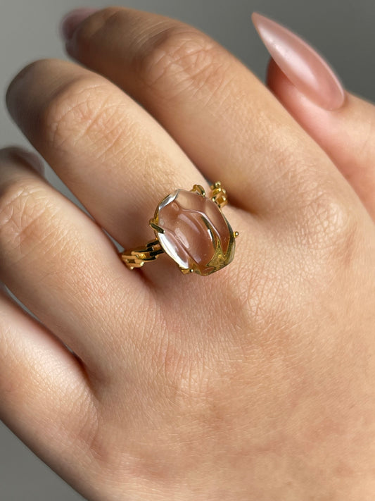 Close-up hand shot of clear quartz freeform ring showing natural transparency and organic cut