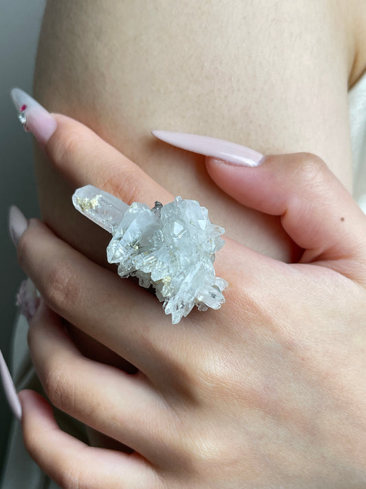 Close-up of Colombian Lemurian Quartz Cluster with Dolomite Ring worn on hand