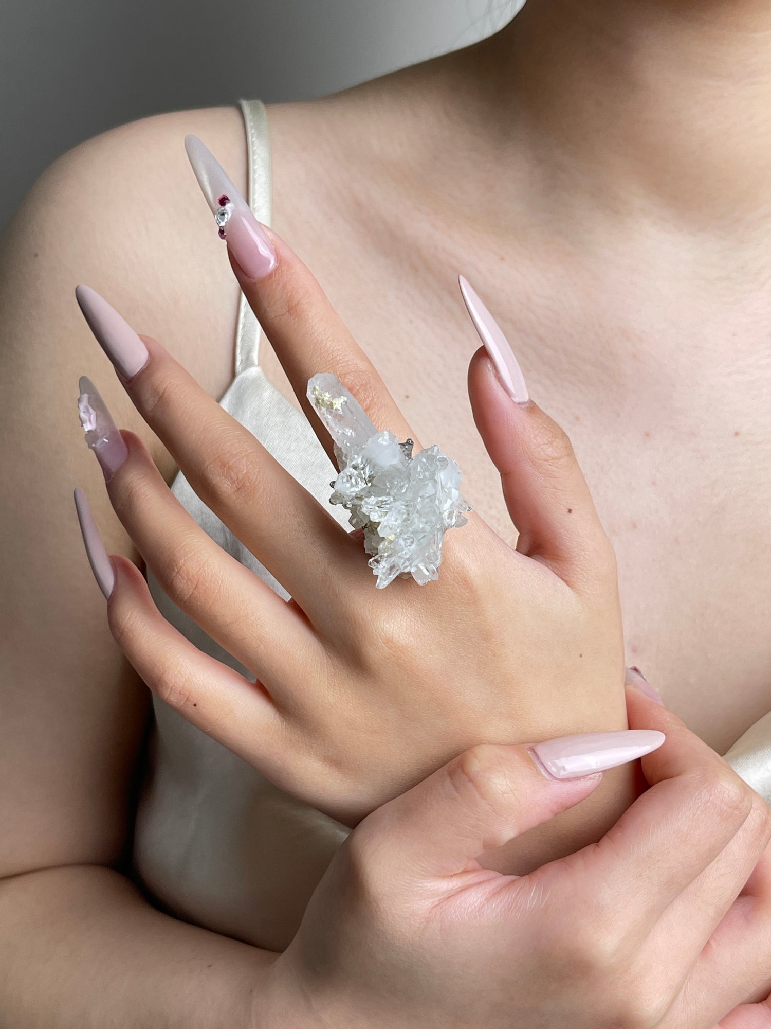 Colombian Lemurian Quartz Cluster with Dolomite Ring worn on hand as mineral specimen jewelry