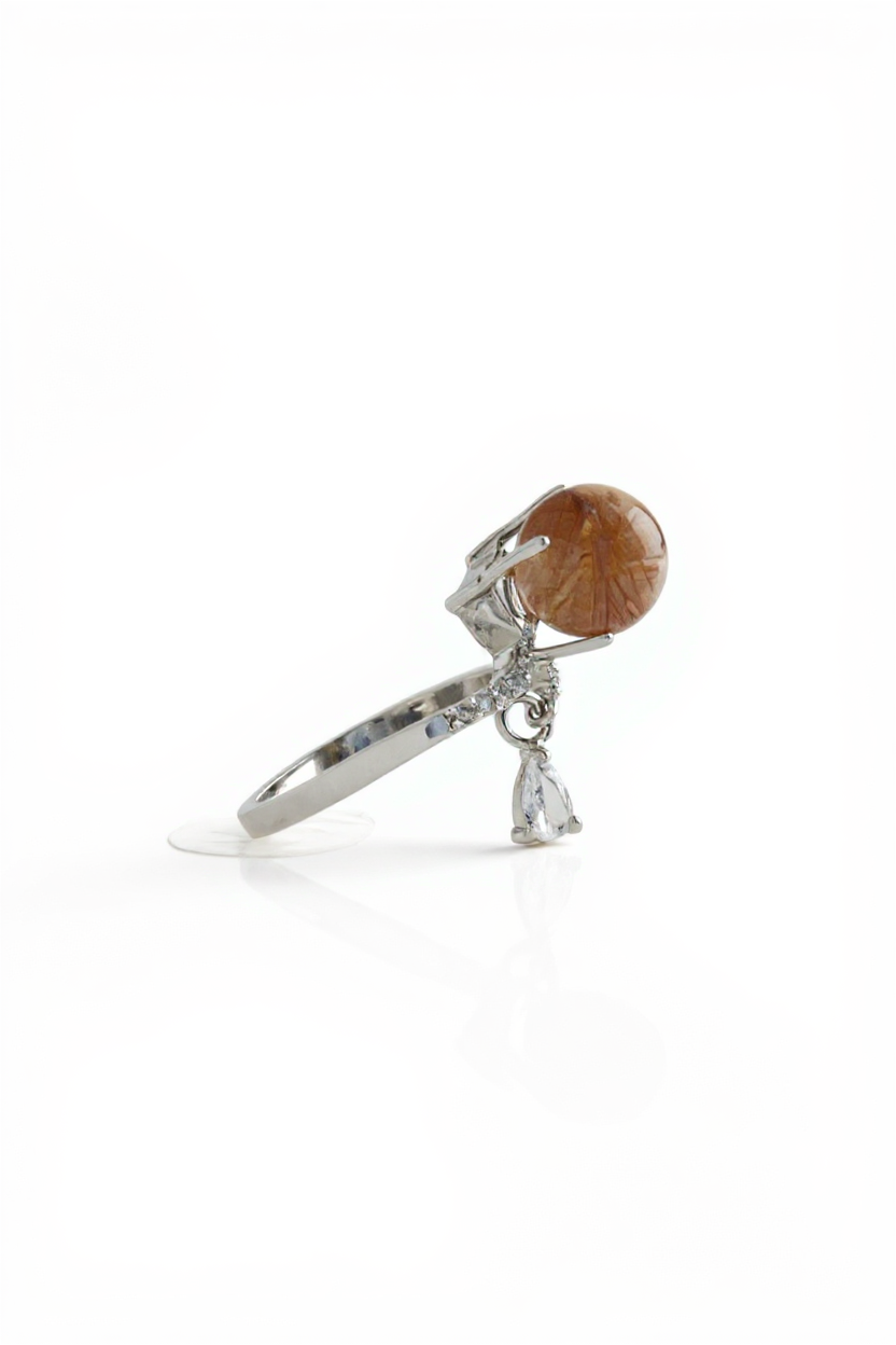 Side view of copper rutilated quartz ring with adjustable band
