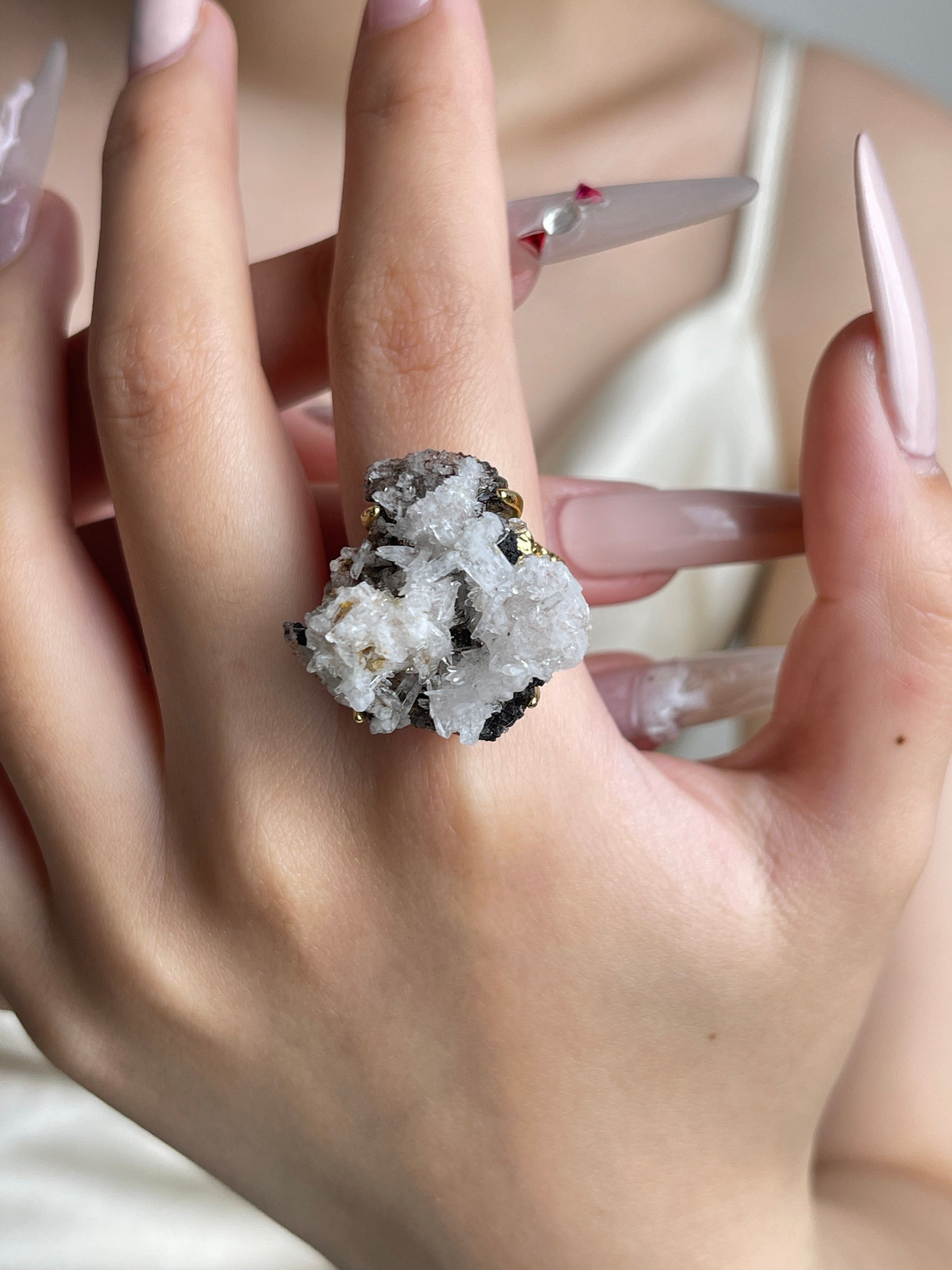 Creedite mineral specimen ring worn on hand