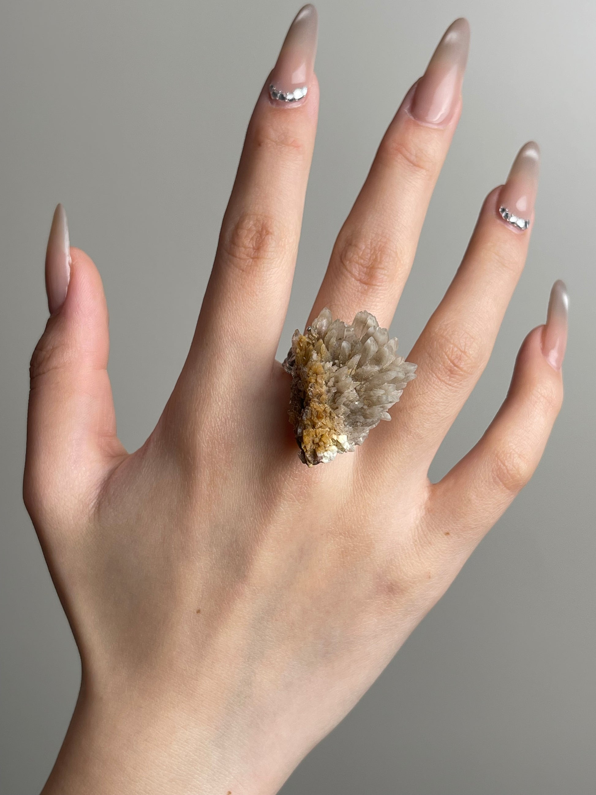 Creedite mineral specimen ring worn on hand