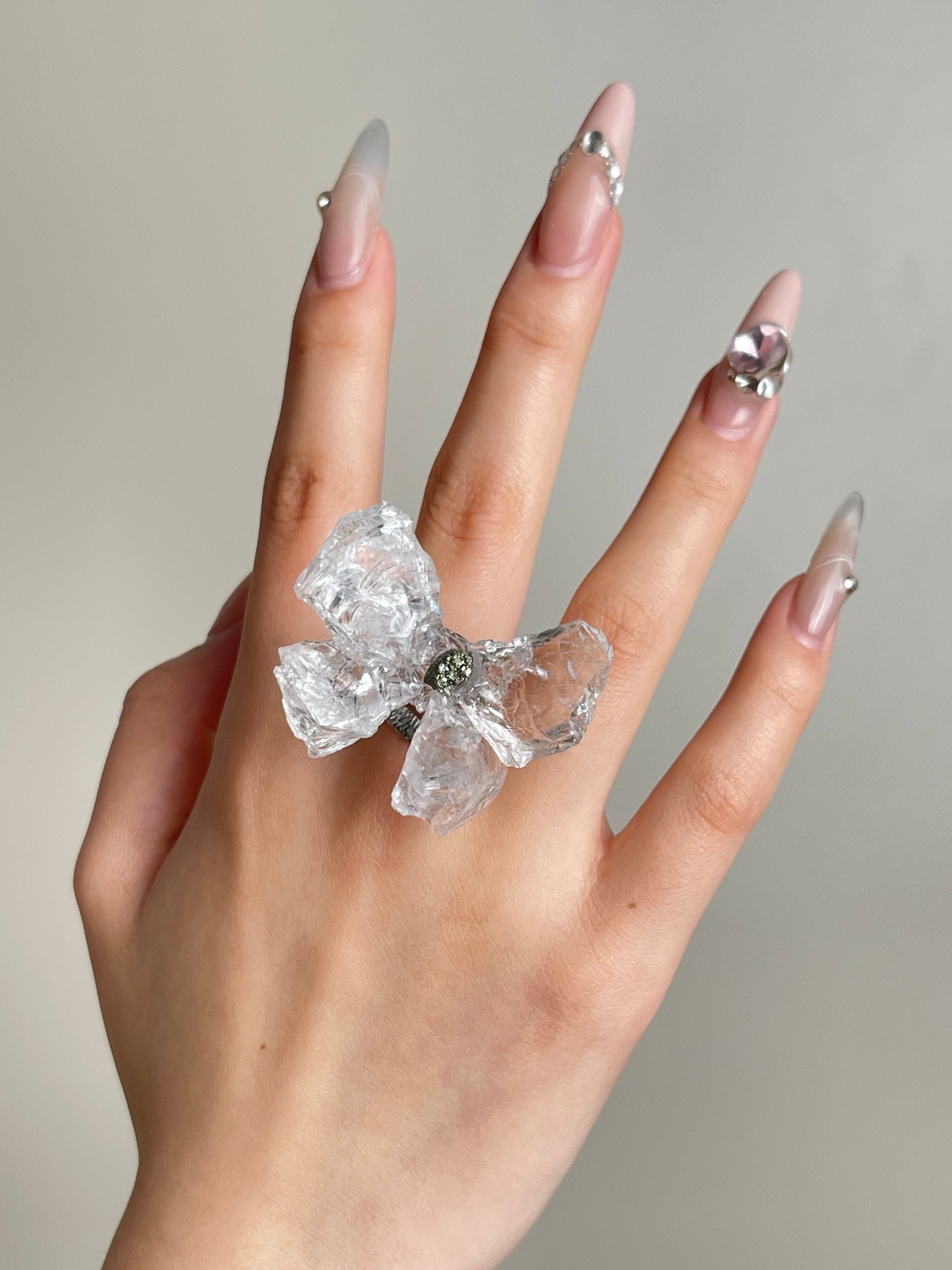Crystal Butterfly Ring worn on hand with natural Brazilian Quartz and Peruvian Chalcopyrite