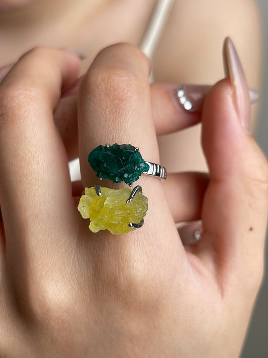 Close-up hand shot of Dioptase and Brucite mineral specimen ring