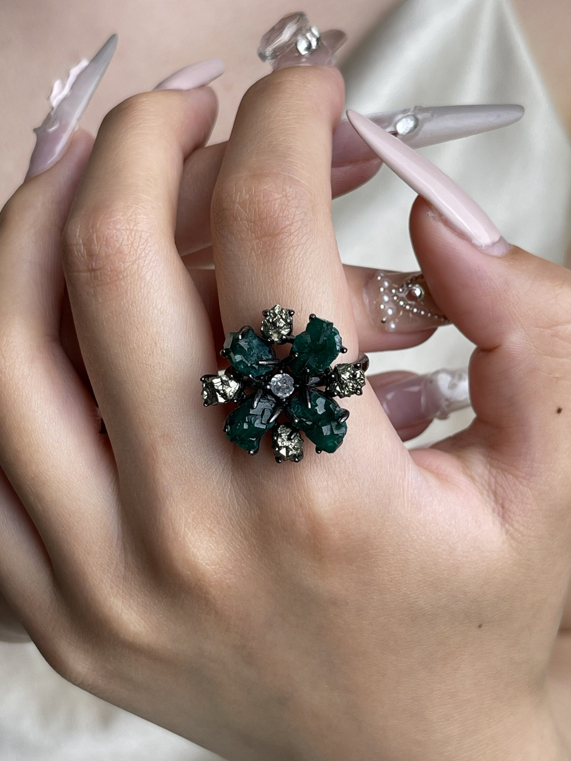 Raw Dioptase and Chalcopyrite mineral specimen snowflake ring worn on hand