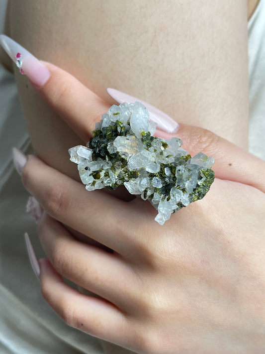 Close-up of Epidote and Quartz Crystal Cluster Ring worn on hand