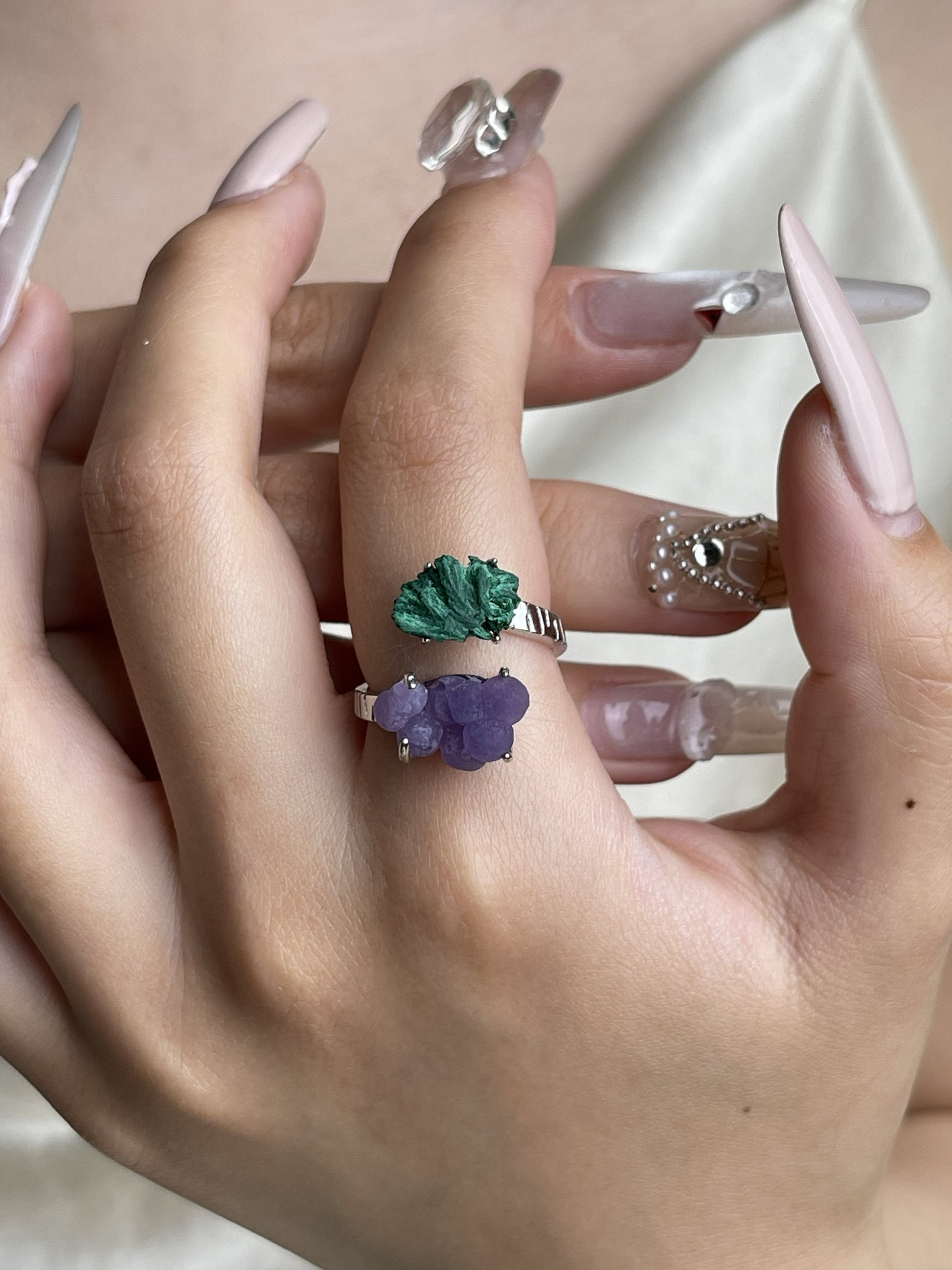 Raw Fibrous Malachite and Purple Grape Agate ring worn on hand
