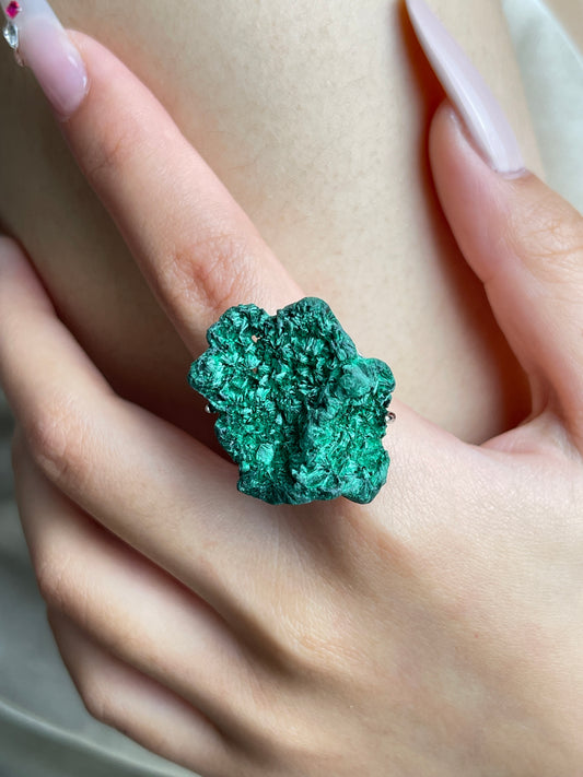 Close-up of Fibrous Malachite mineral specimen ring worn on hand