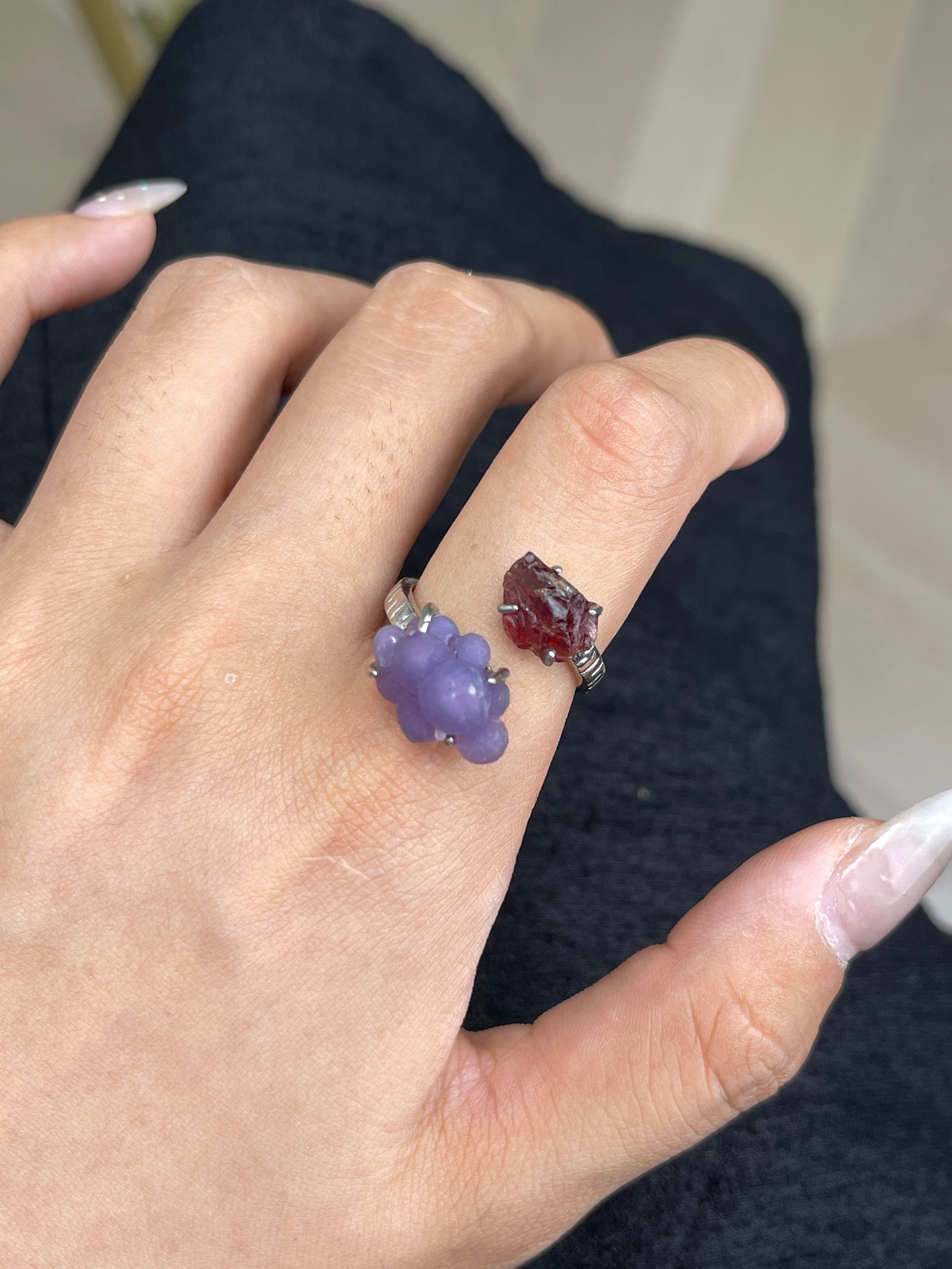 Close-up hand wearing raw Garnet and Purple Grape Agate ring