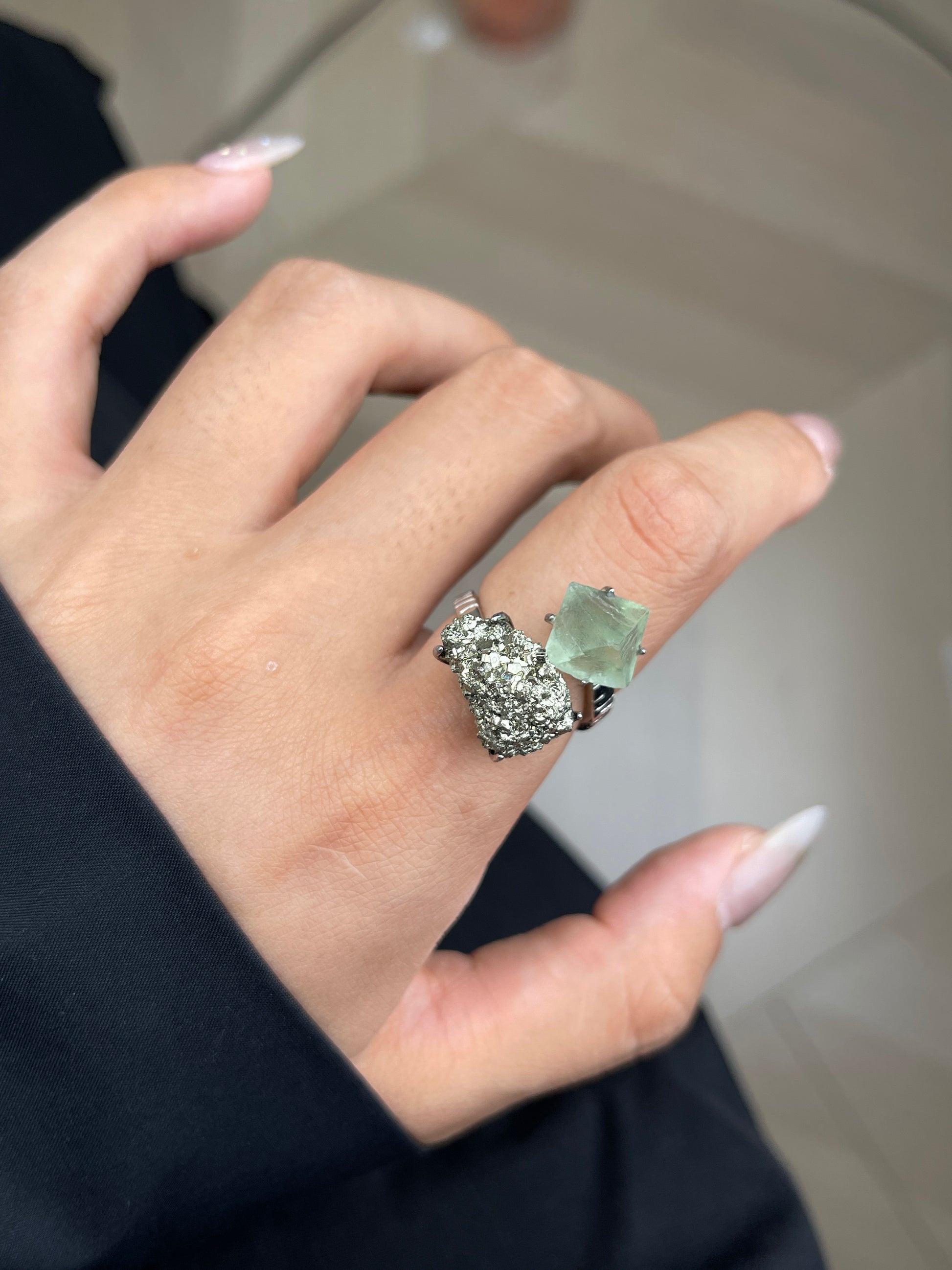 Close up of Green Octahedral Fluorite and Chalcopyrite ring on hand
