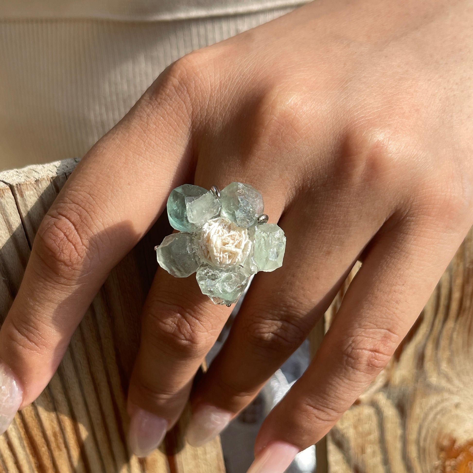 Close-up hand view of Green Fluorite Flower Ring with Desert Rose