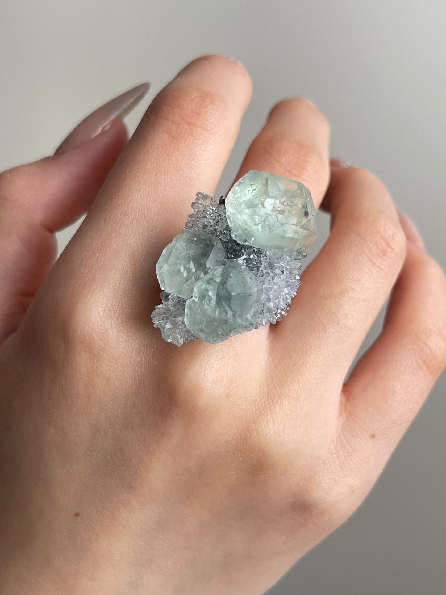 Green fluorite with quartz mineral specimen ring close-up on hand